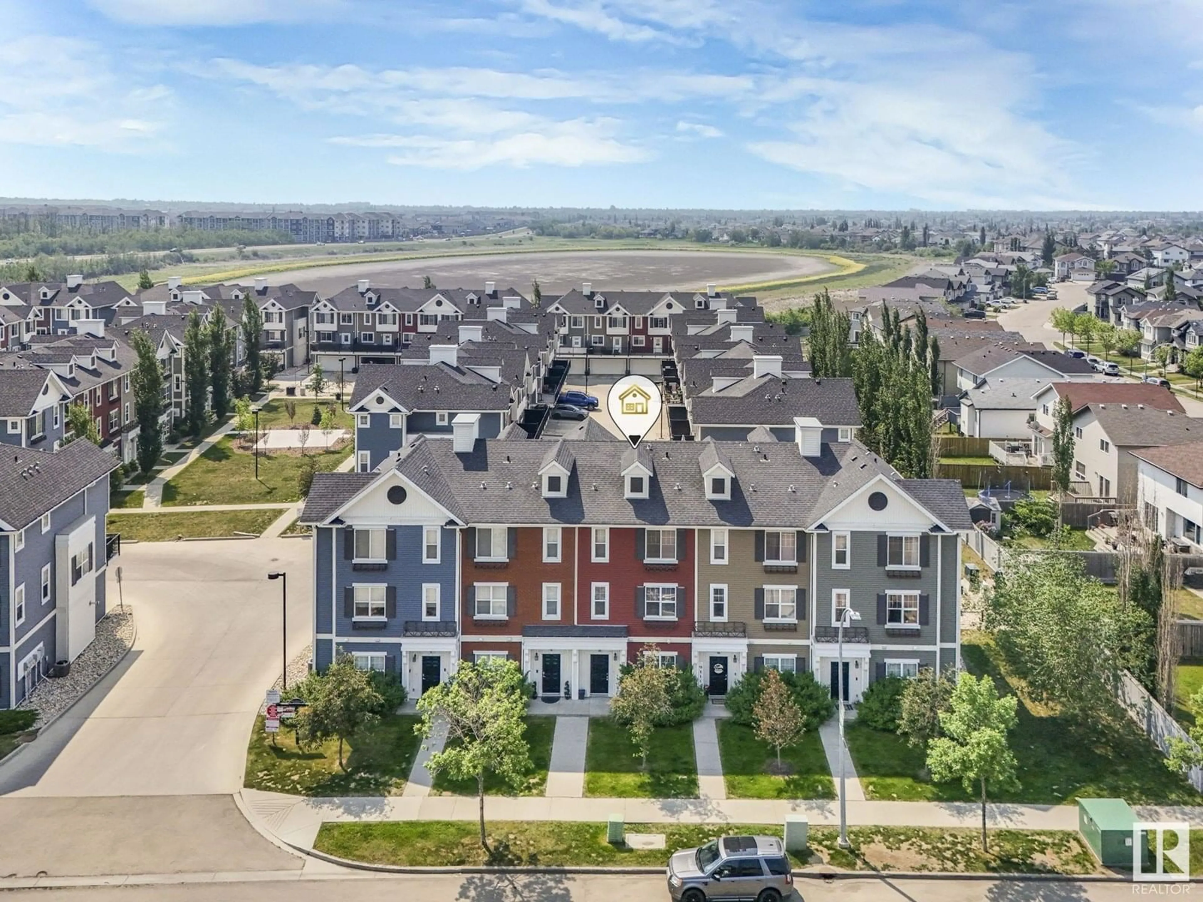A pic from outside/outdoor area/front of a property/back of a property/a pic from drone, unknown for 69 8315 180 AV NW, Edmonton Alberta T5Z0J2