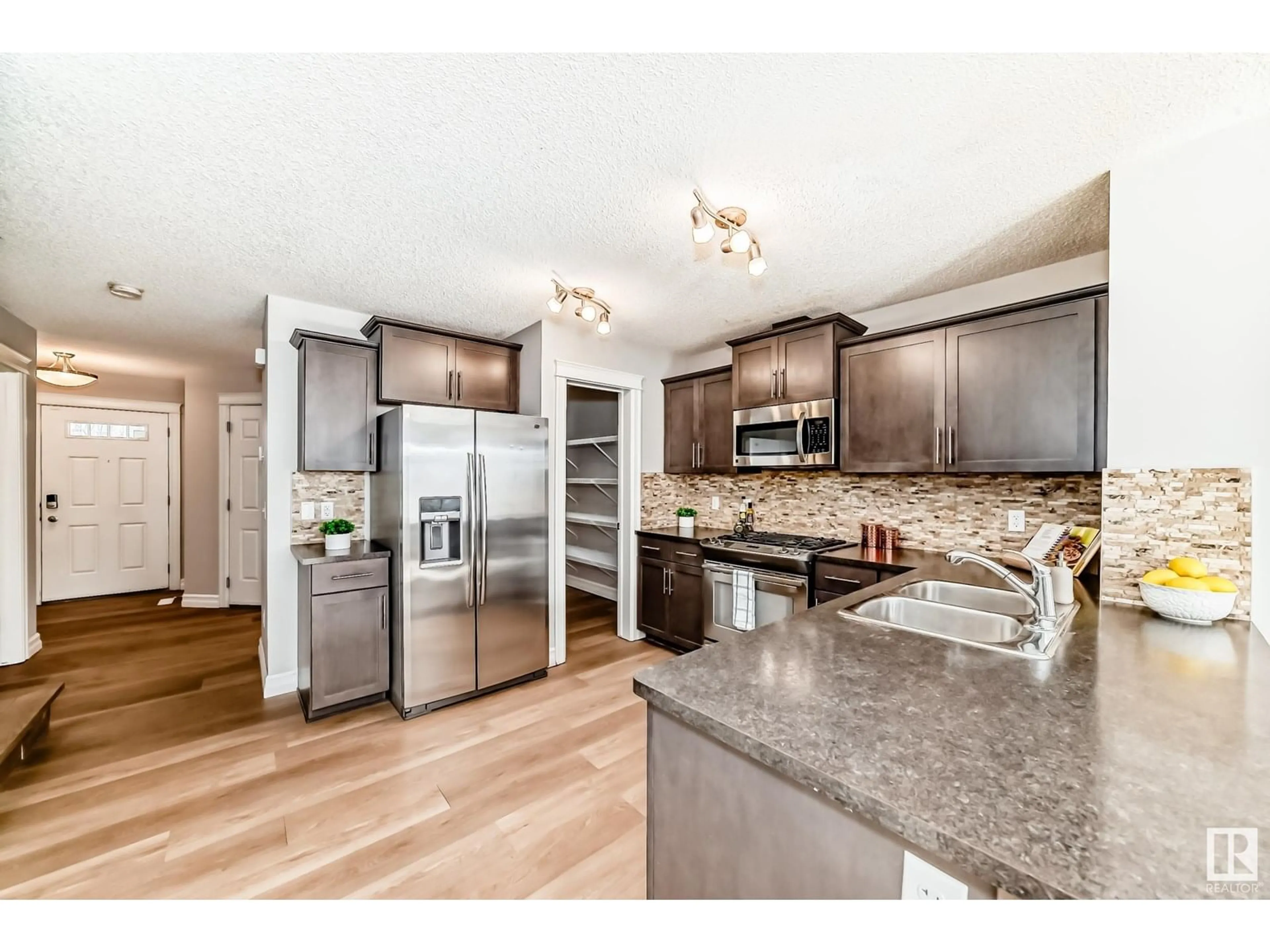 Open concept kitchen, unknown for 5407 15 AV, Edmonton Alberta T6X1R5