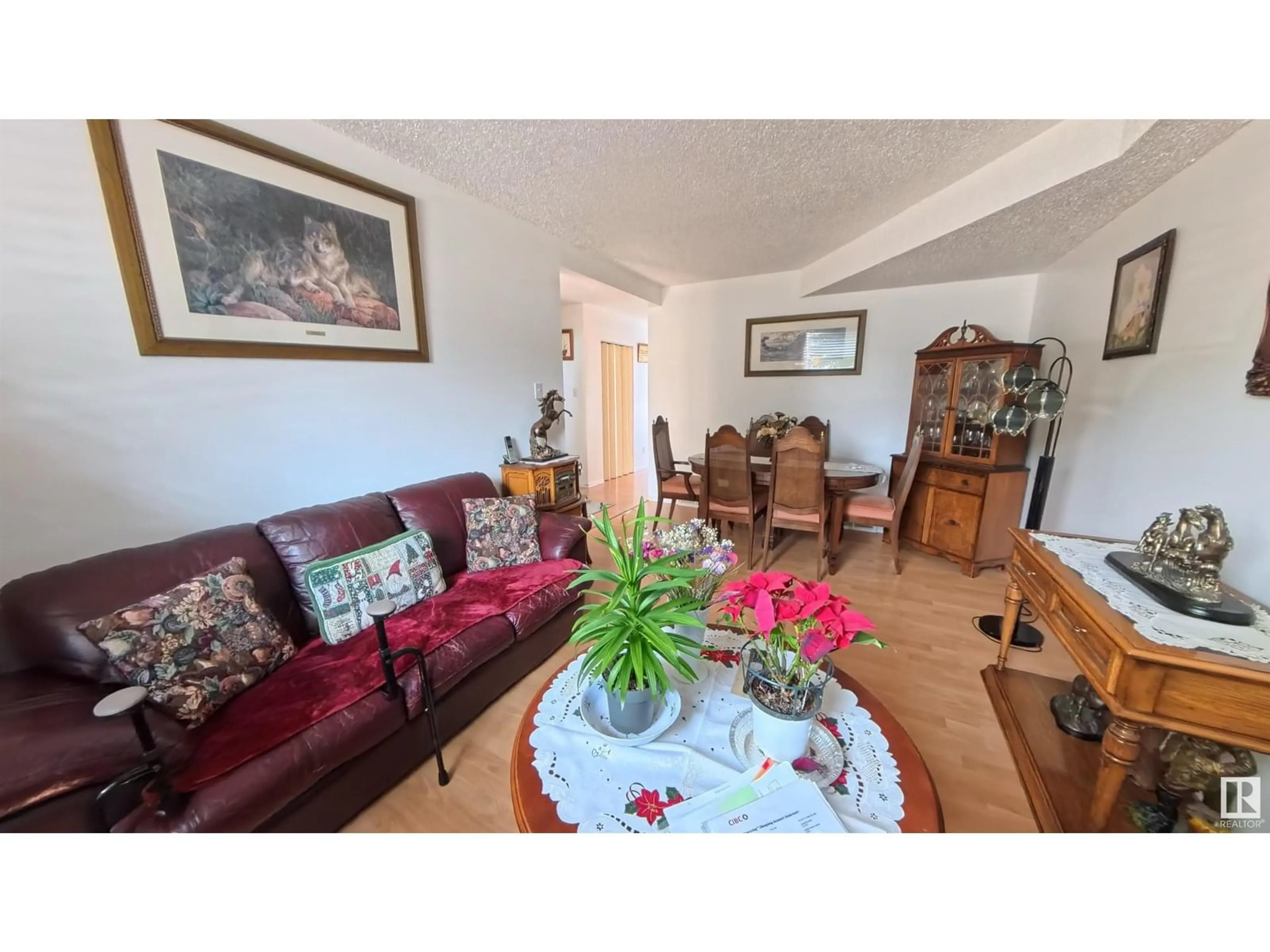 Living room with furniture, wood/laminate floor for 3122 142 AV, Edmonton Alberta T5Y1H2