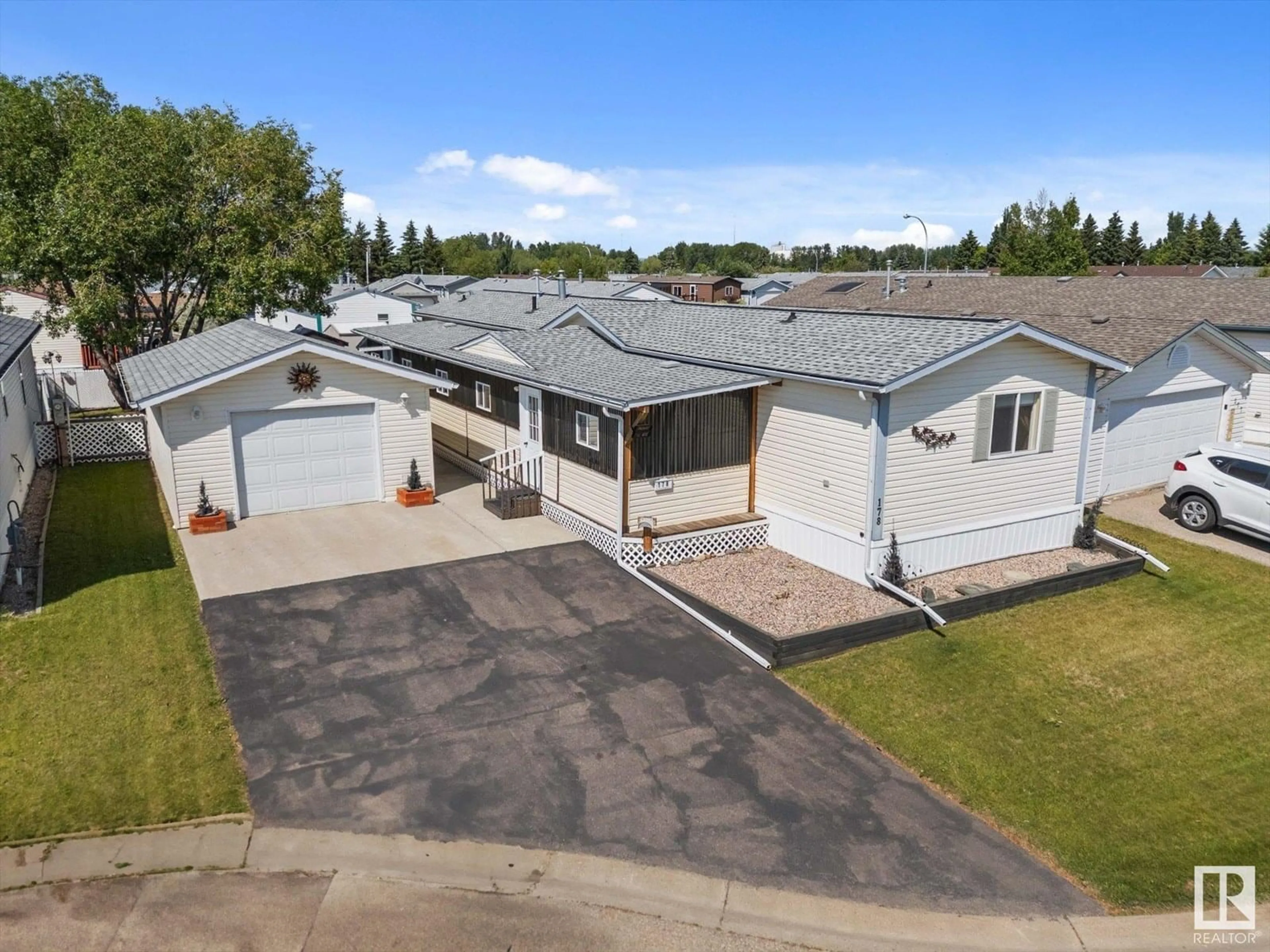 A pic from outside/outdoor area/front of a property/back of a property/a pic from drone, street for 178 - 3400 48 ST, Stony Plain Alberta T7Z1W2