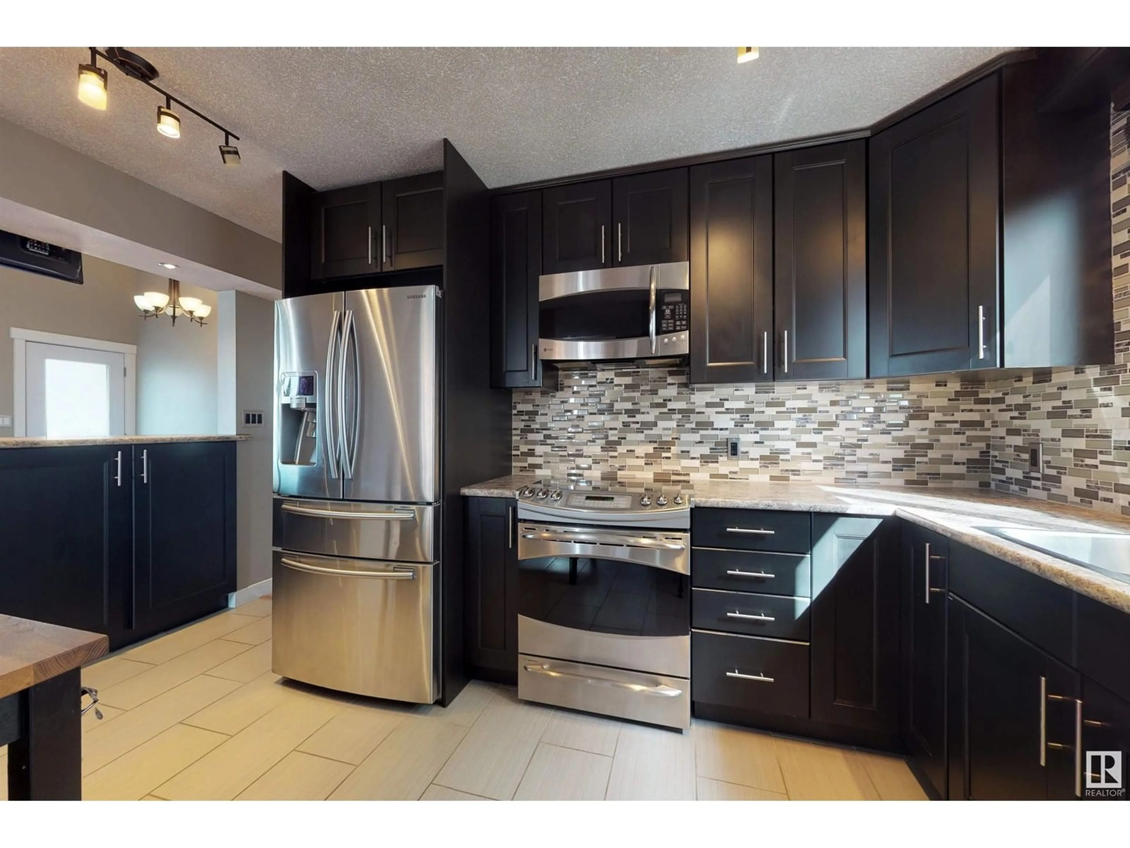 Open concept kitchen, ceramic/tile floor for 14703 75A ST NW, Edmonton Alberta T5C1A3