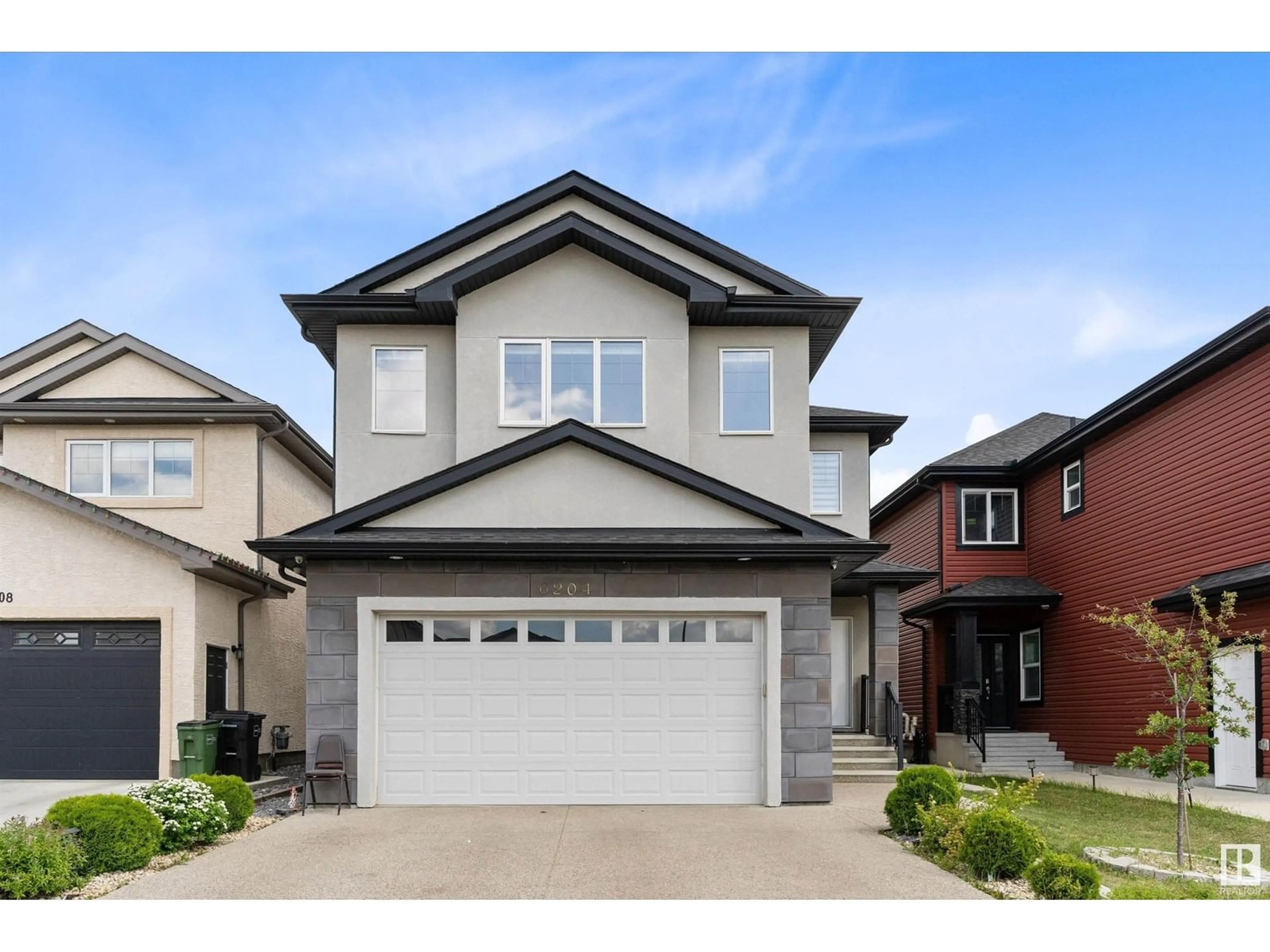 Home with vinyl exterior material, street for NW - 6204 173 AV, Edmonton Alberta T5Y3V5