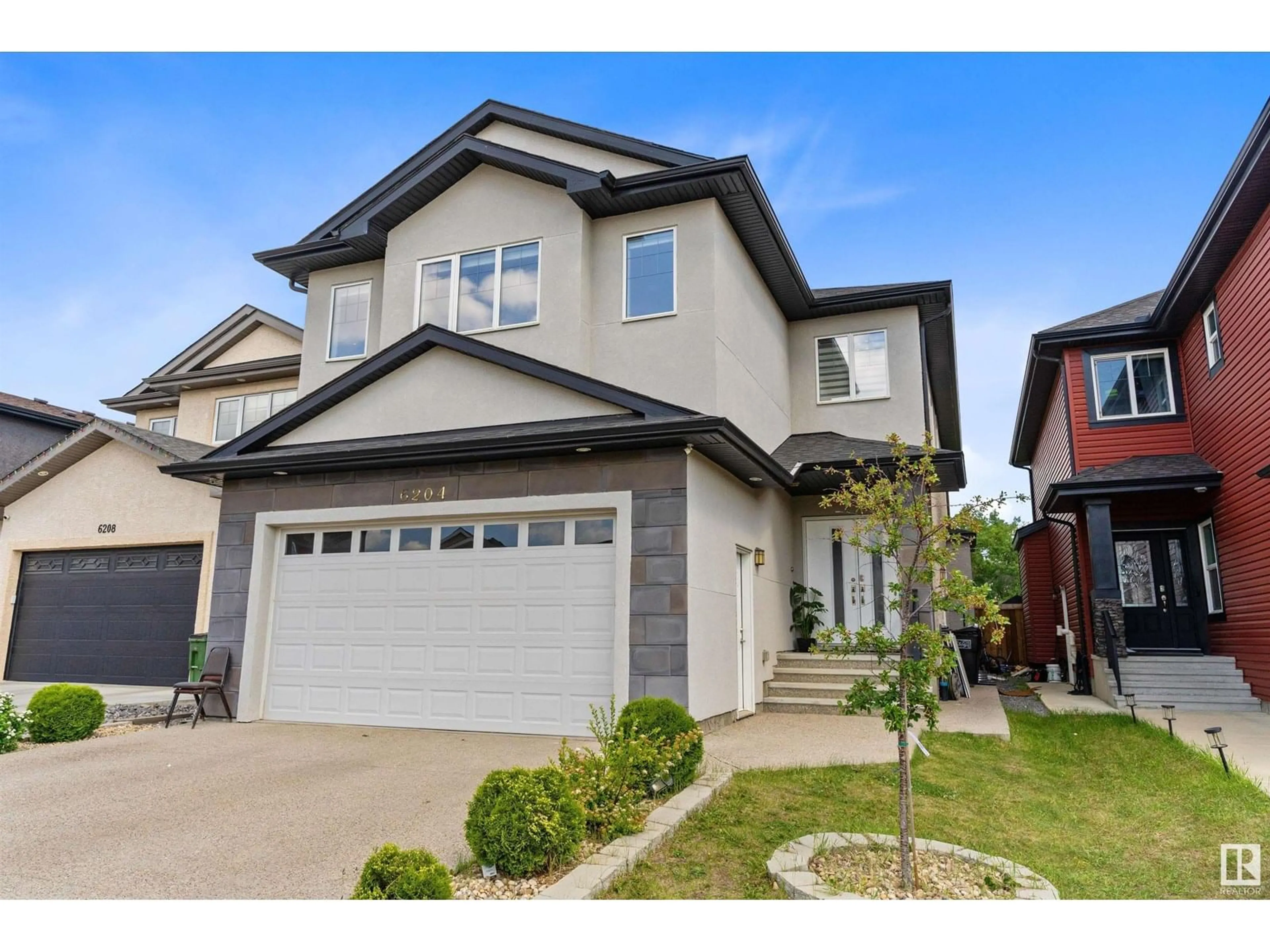 Home with vinyl exterior material, street for NW - 6204 173 AV, Edmonton Alberta T5Y3V5