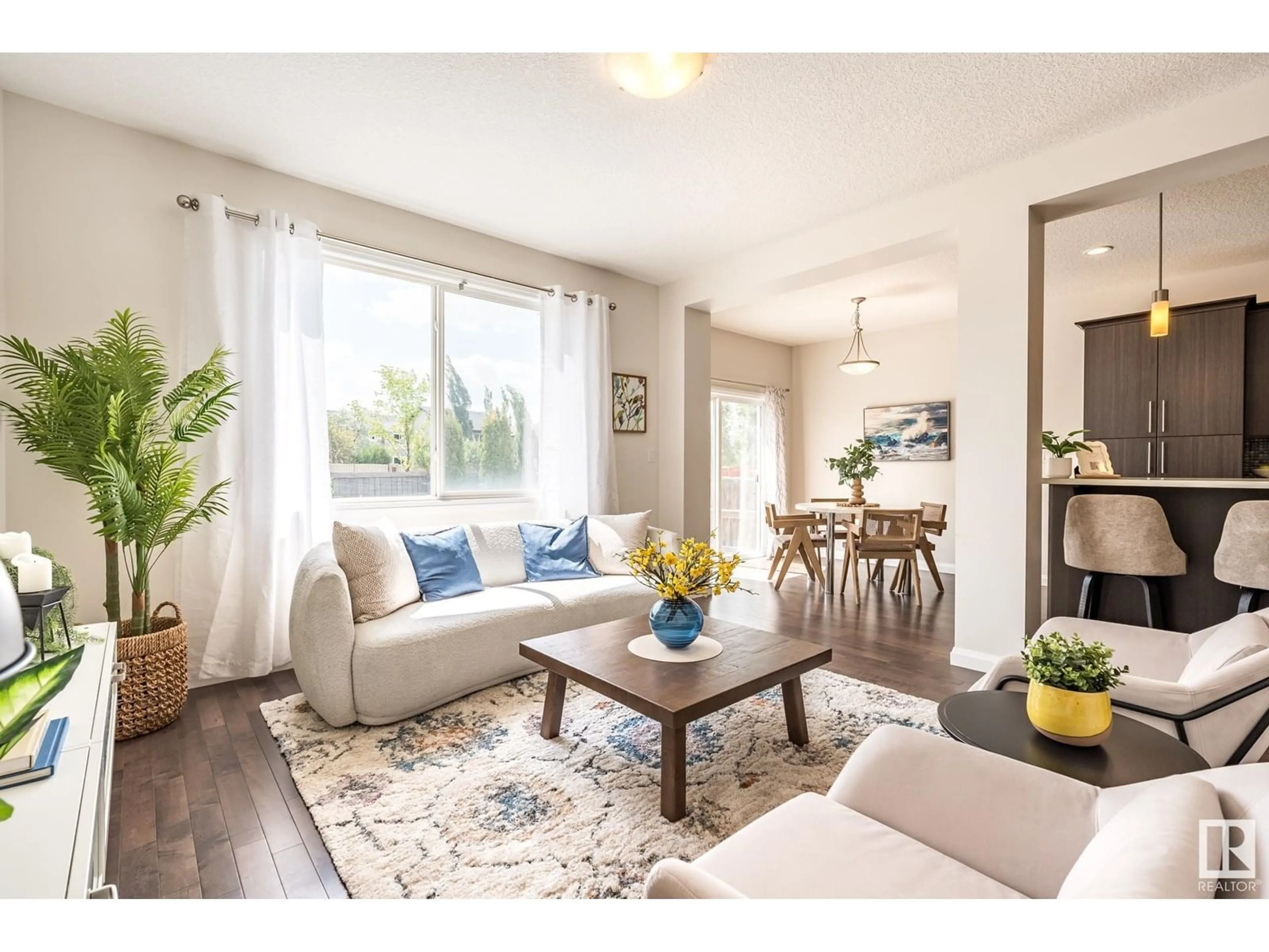 Living room with furniture, wood/laminate floor for 2595 COLE CT, Edmonton Alberta T6W2A3