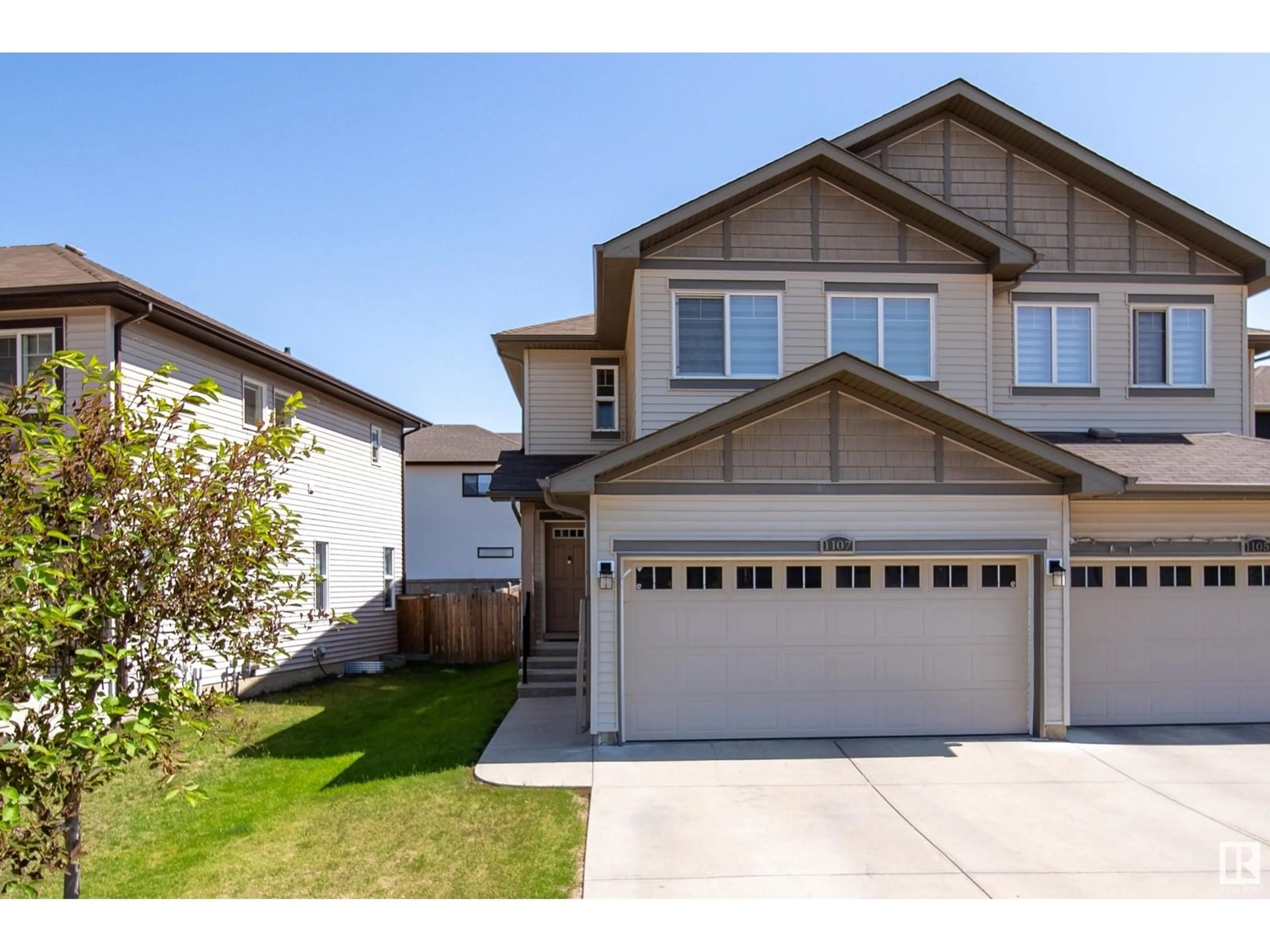 Home with vinyl exterior material, street for NW - 1107 33A ST, Edmonton Alberta T6T2C4