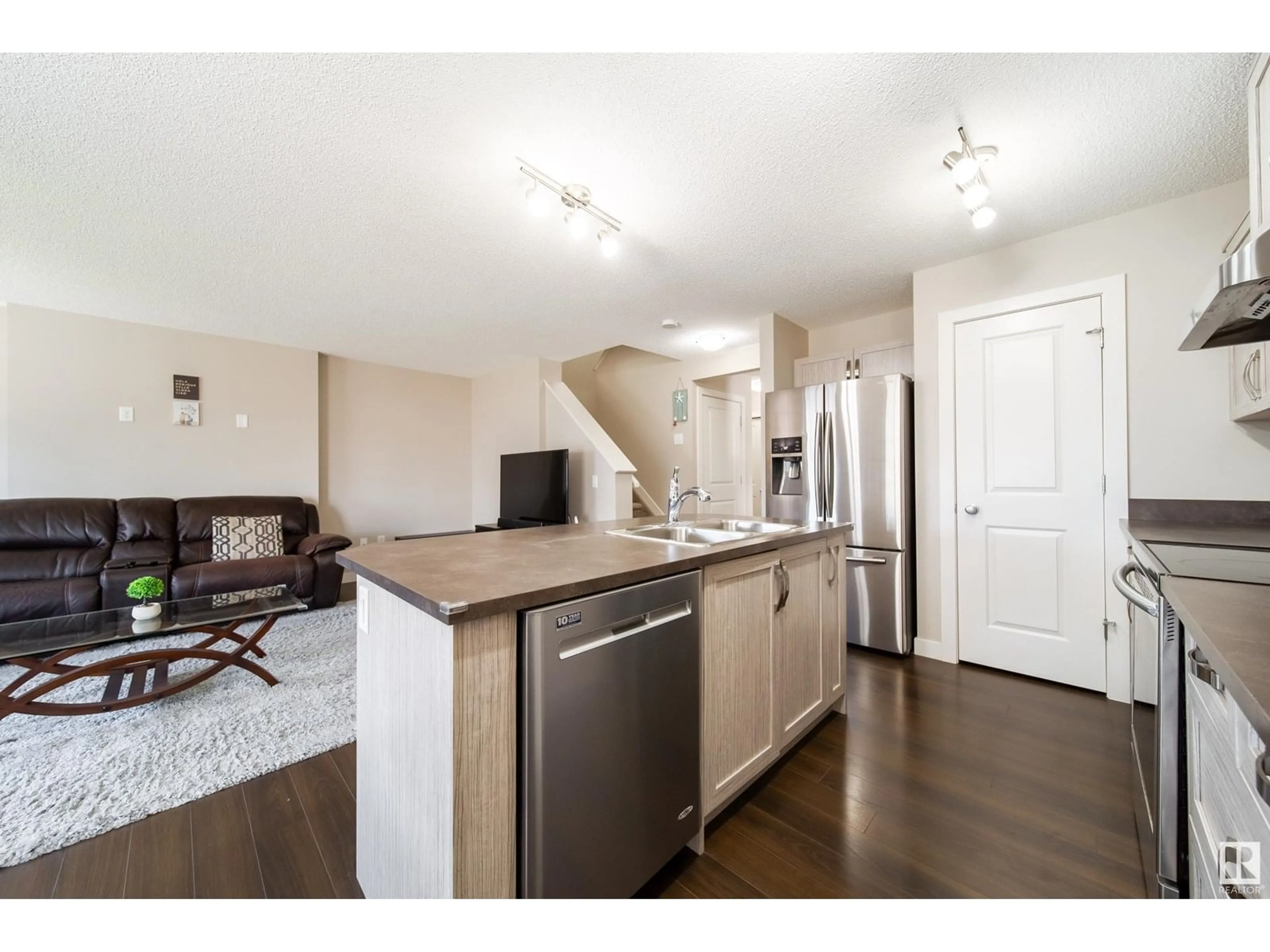 Open concept kitchen, wood/laminate floor for NW - 1107 33A ST, Edmonton Alberta T6T2C4