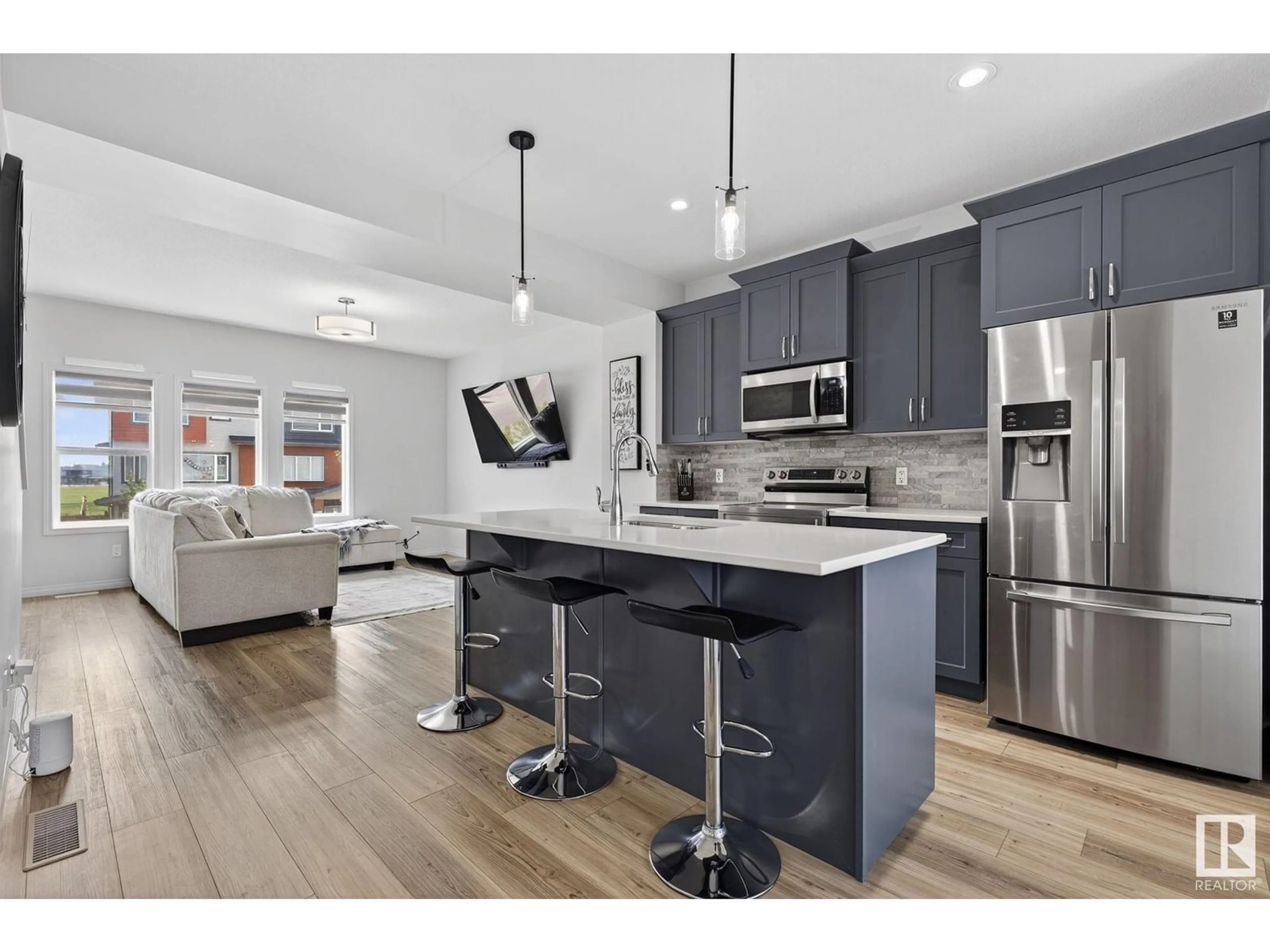 Open concept kitchen, wood/laminate floor for SW - 1524 157 ST, Edmonton Alberta T6W4J8