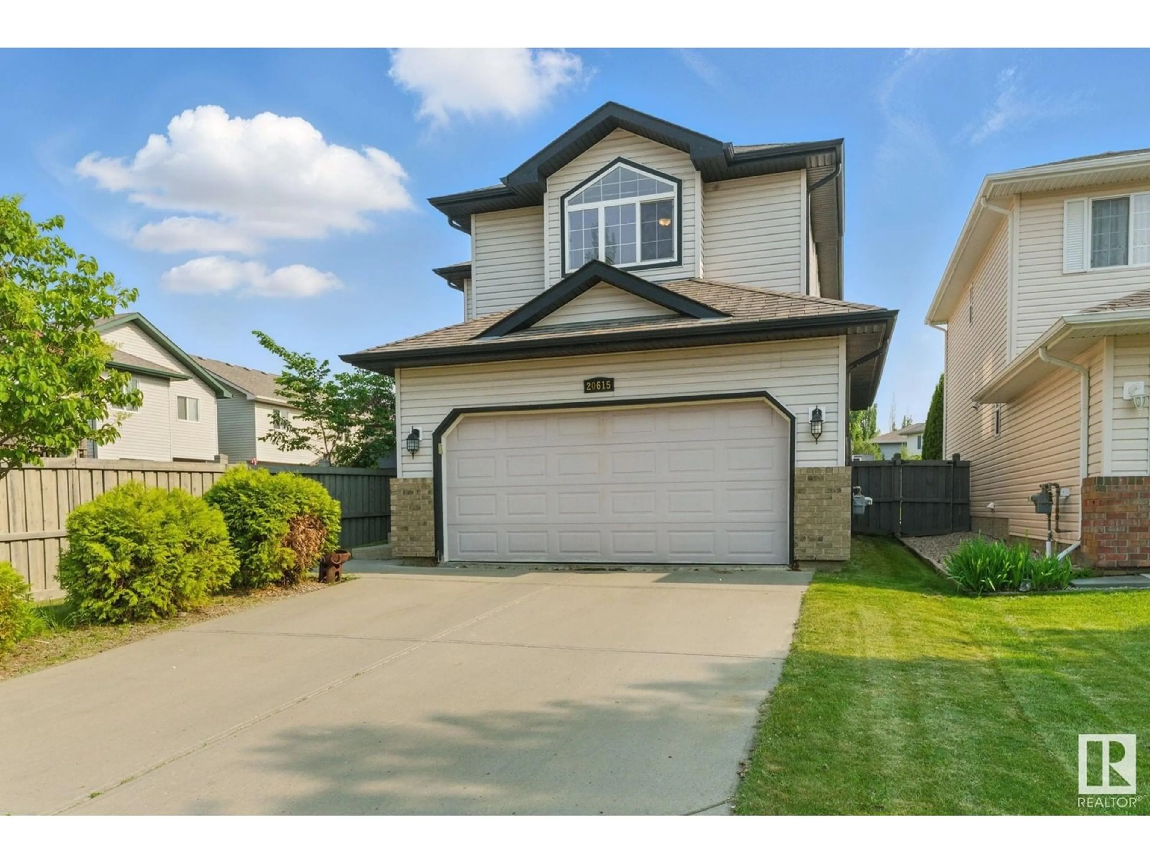 Home with vinyl exterior material, street for NW - 20615 50 AV, Edmonton Alberta T6M0C4