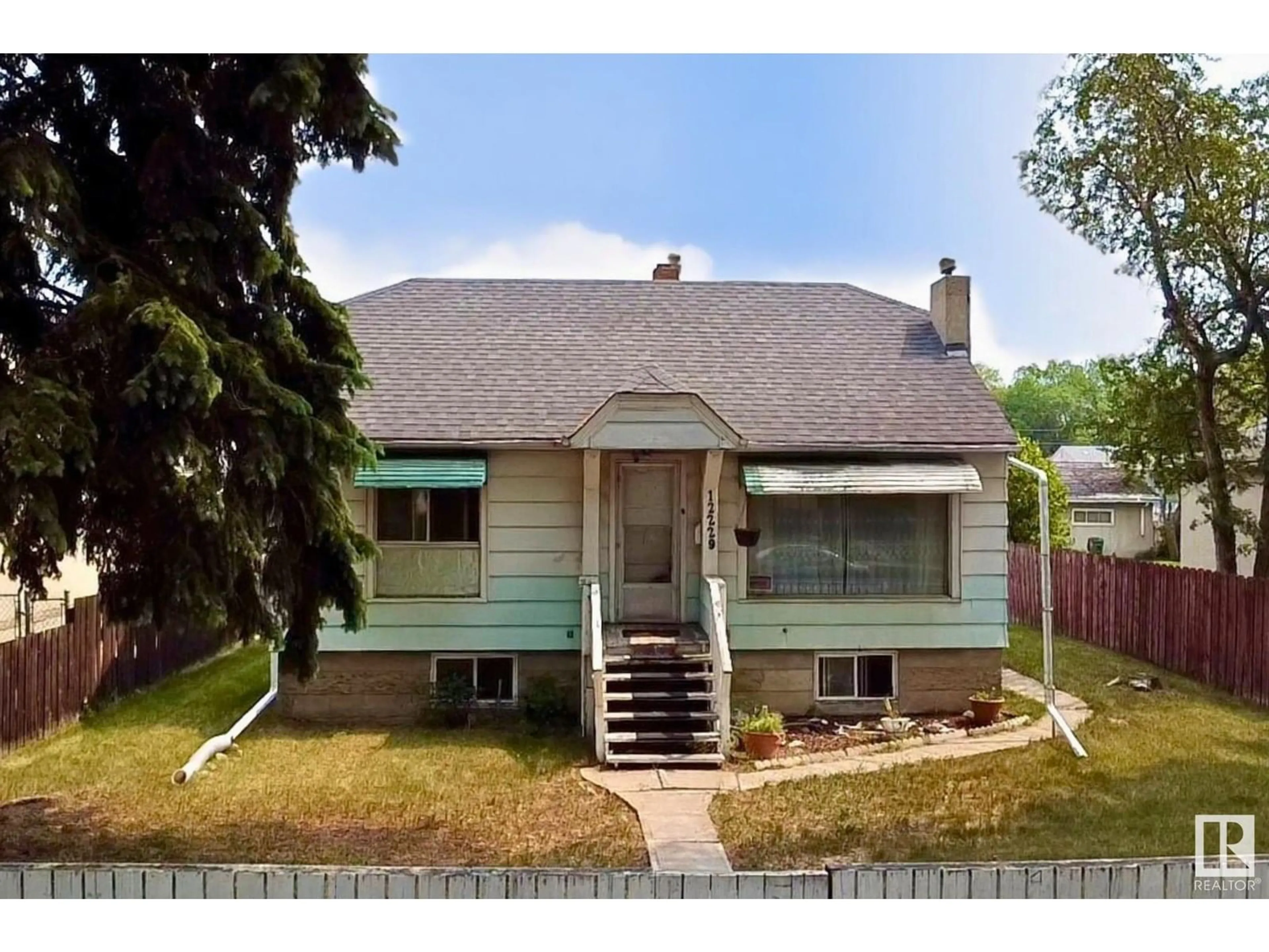 Home with vinyl exterior material, street for NW - 12229 85 ST, Edmonton Alberta T5B3G8