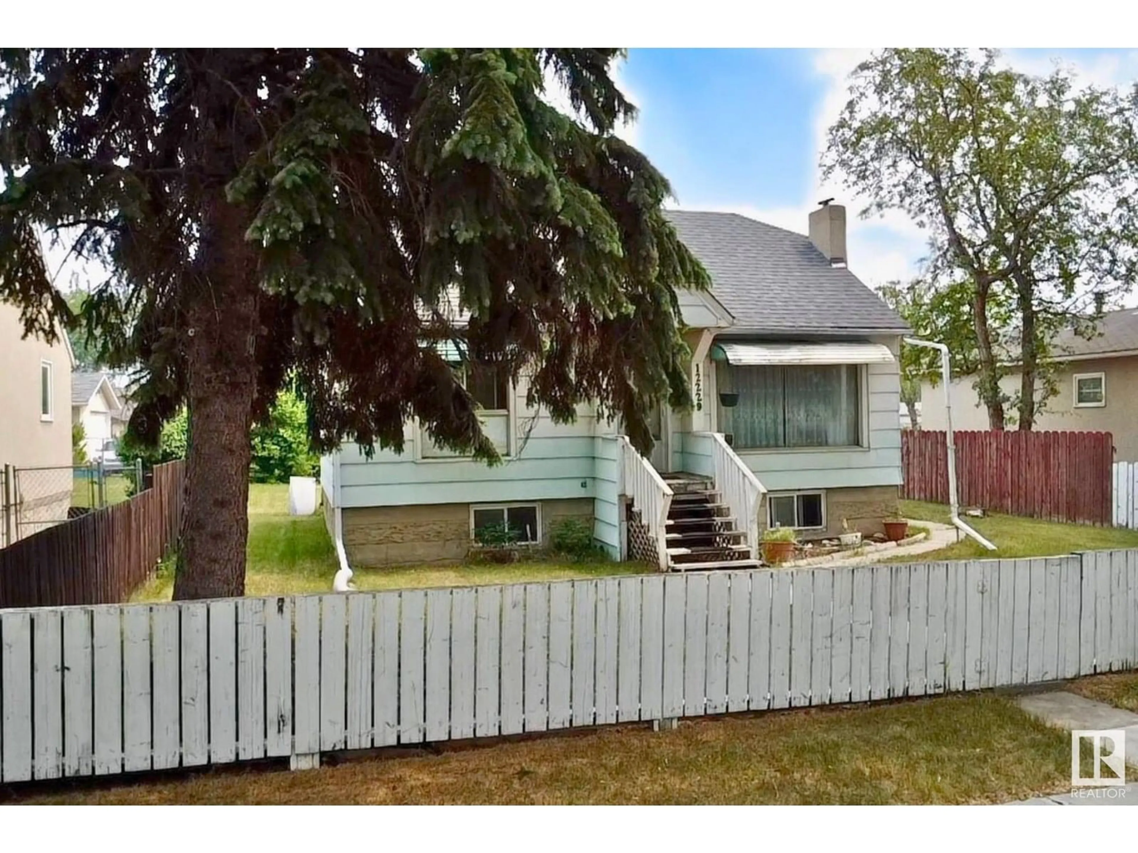 Home with vinyl exterior material, street for NW - 12229 85 ST, Edmonton Alberta T5B3G8