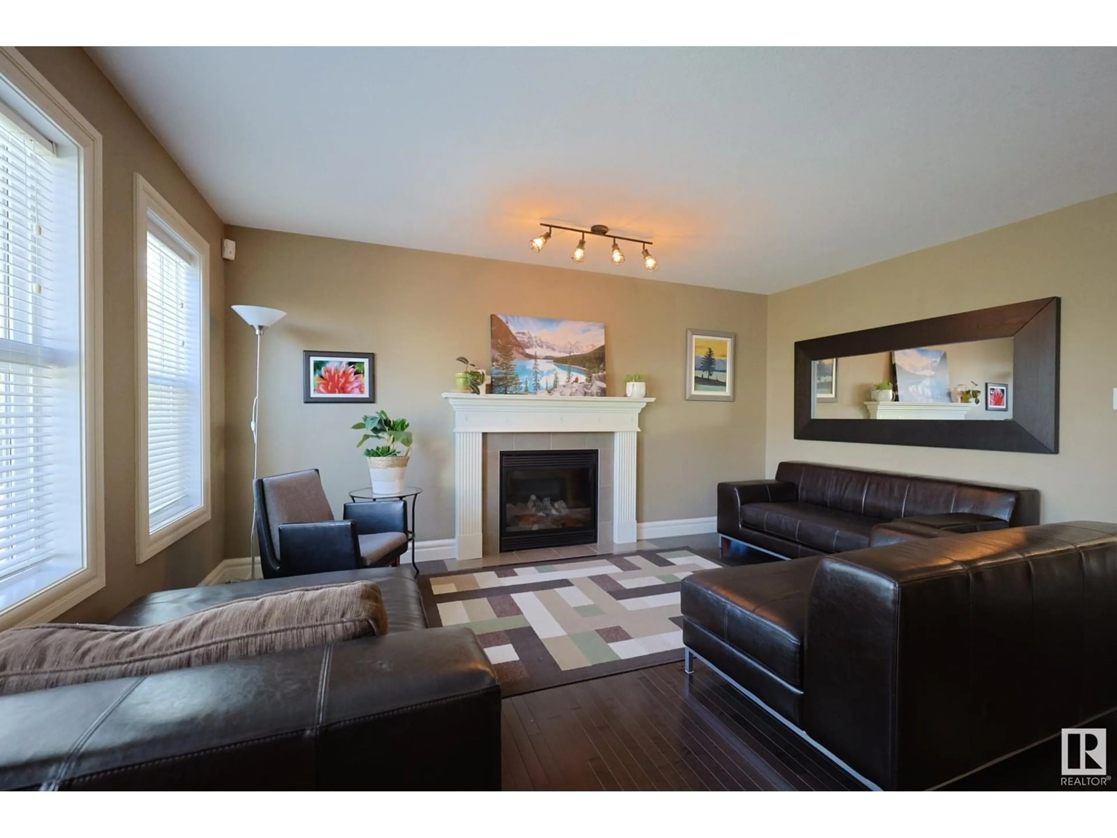 Living room with furniture, wood/laminate floor for NW - 20316 46 AV, Edmonton Alberta T6M0A7