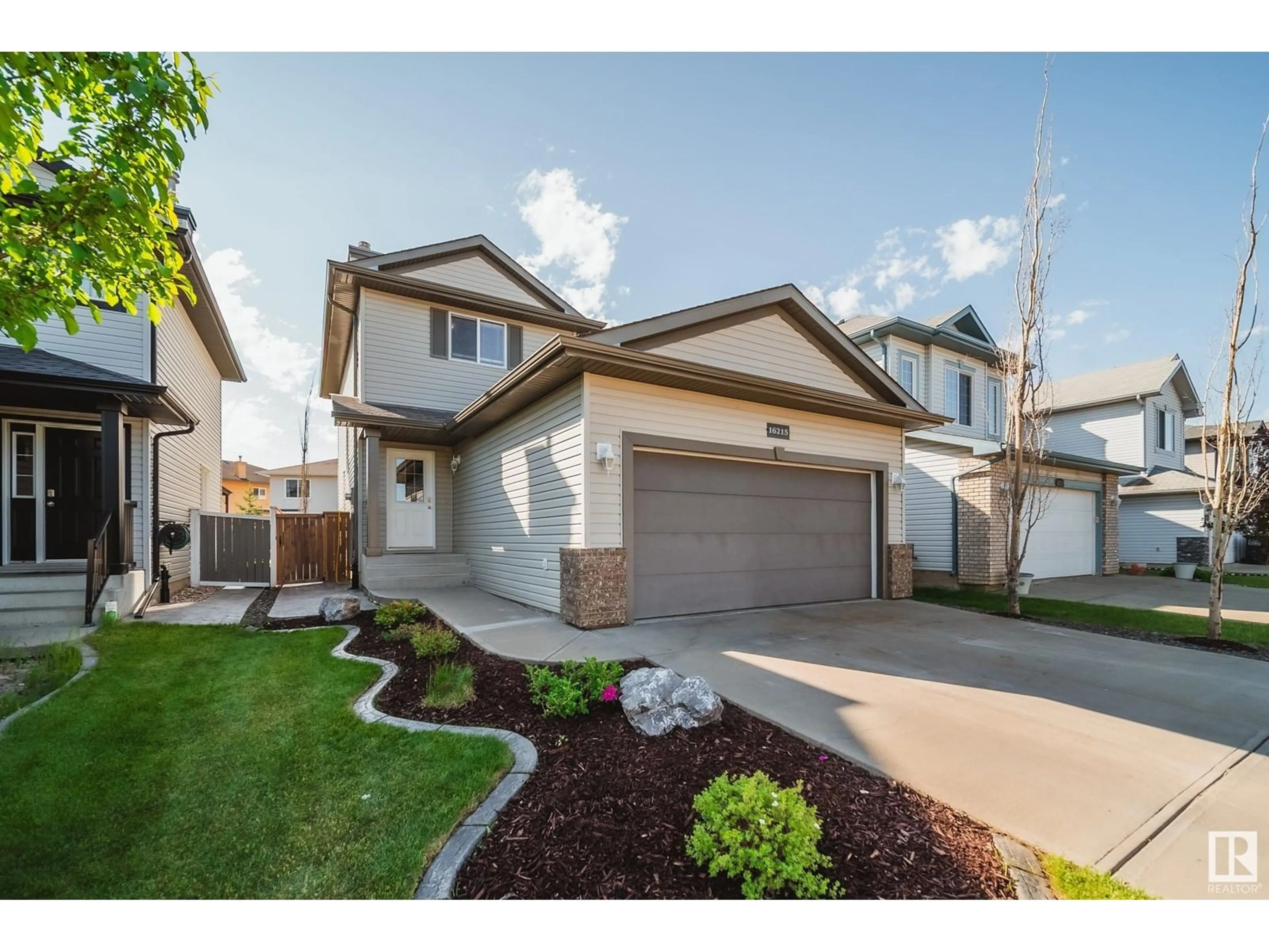 Home with vinyl exterior material, street for 16215 47 ST, Edmonton Alberta T5Y3M4