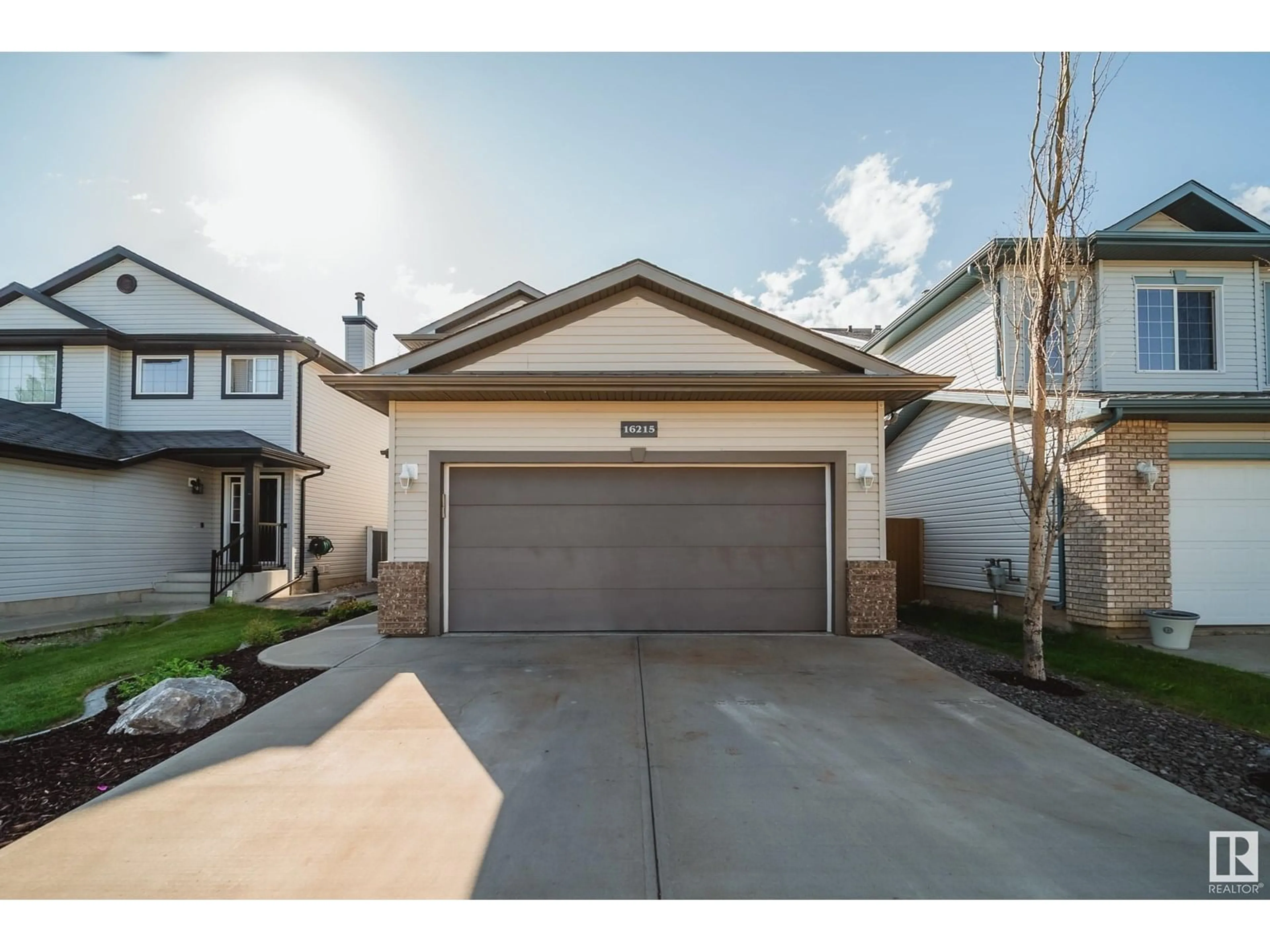 Home with vinyl exterior material, street for 16215 47 ST, Edmonton Alberta T5Y3M4