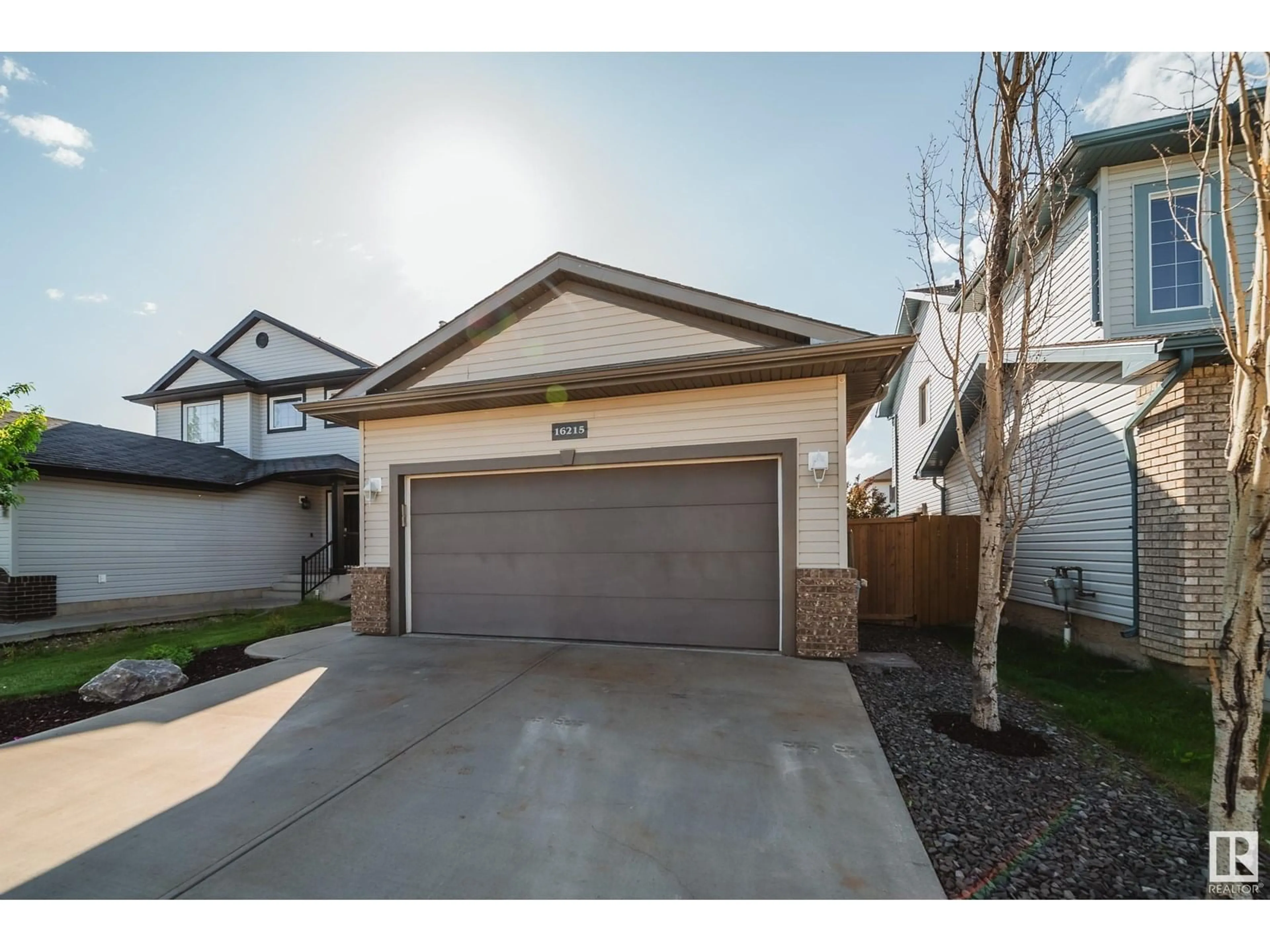 Home with vinyl exterior material, street for 16215 47 ST, Edmonton Alberta T5Y3M4