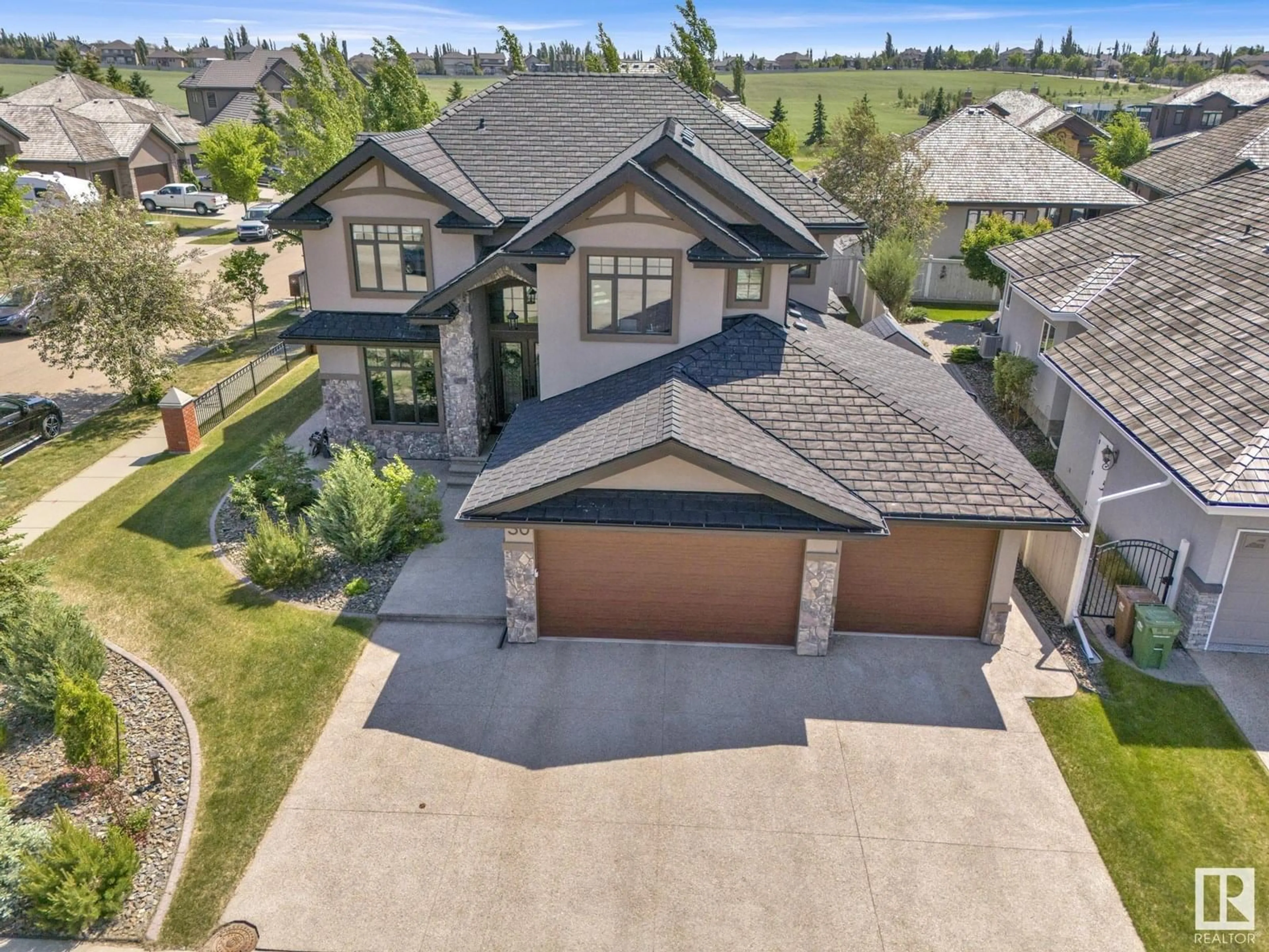A pic from outside/outdoor area/front of a property/back of a property/a pic from drone, street for 30 KINGSMEADE CR, St. Albert Alberta T8N4C8