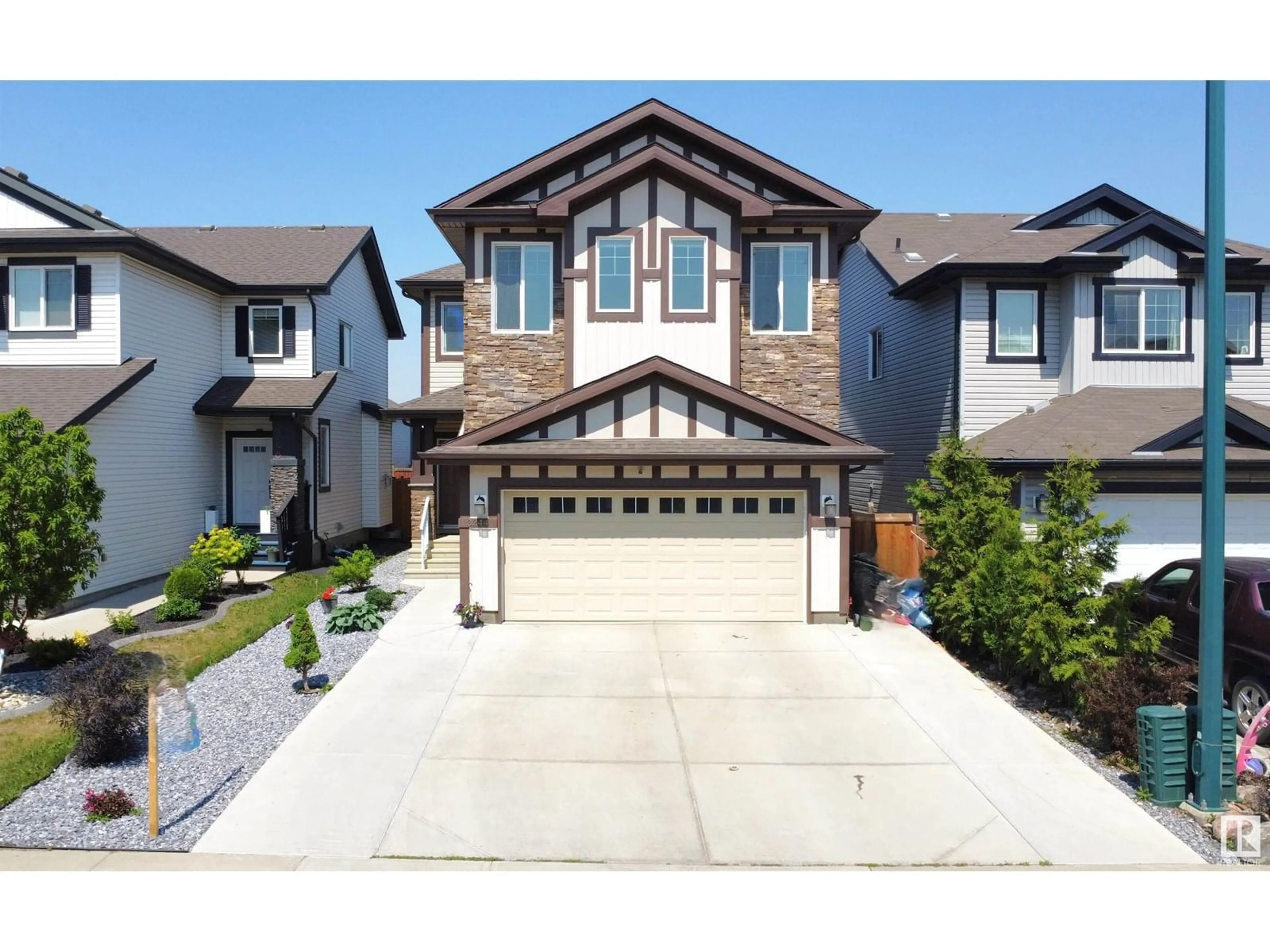 Home with vinyl exterior material, street for NW - 3244 13 AVE AV, Edmonton Alberta T6T0Z4