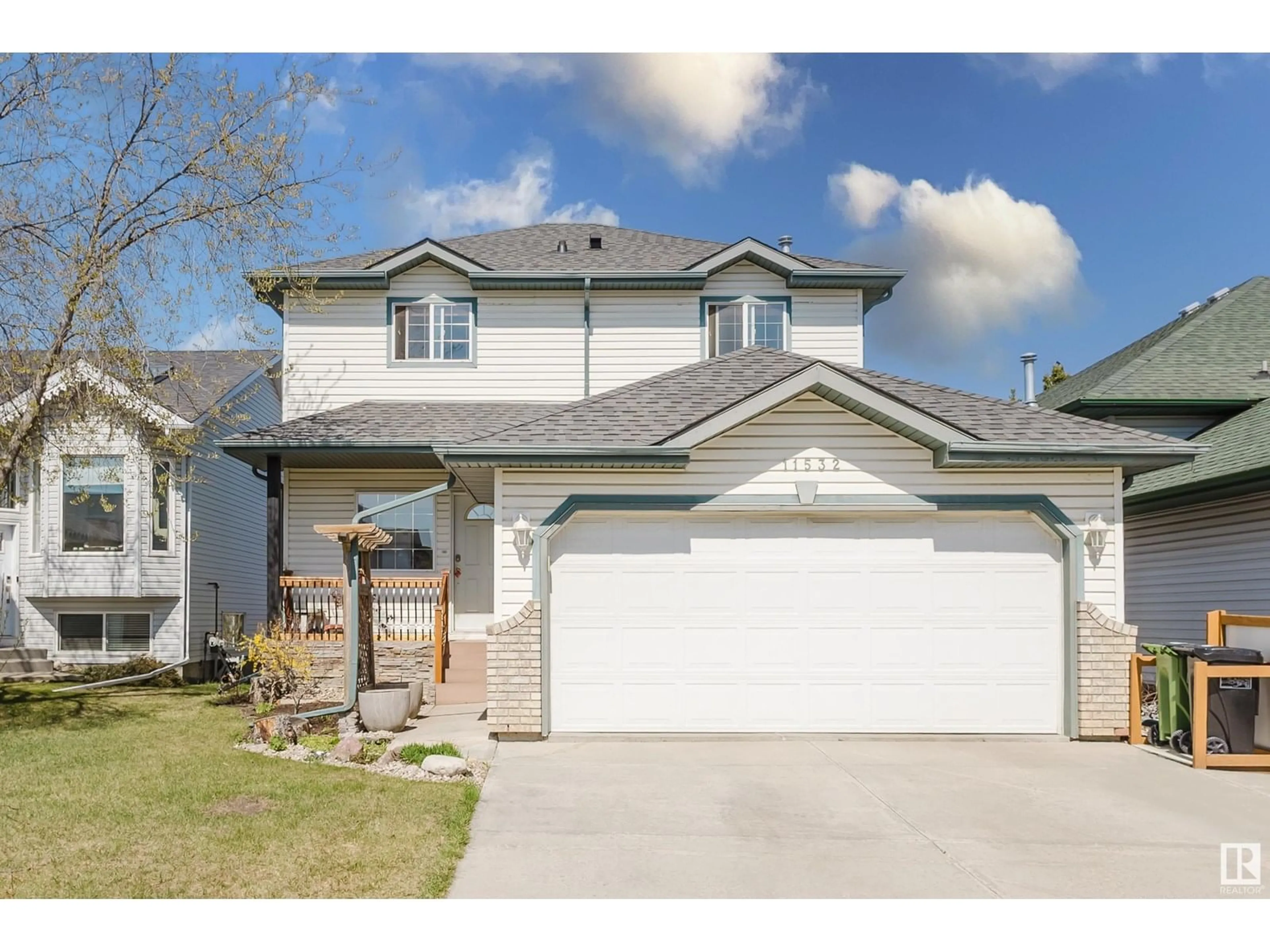 Home with vinyl exterior material, street for 11532 170 AV, Edmonton Alberta T5X5Z4