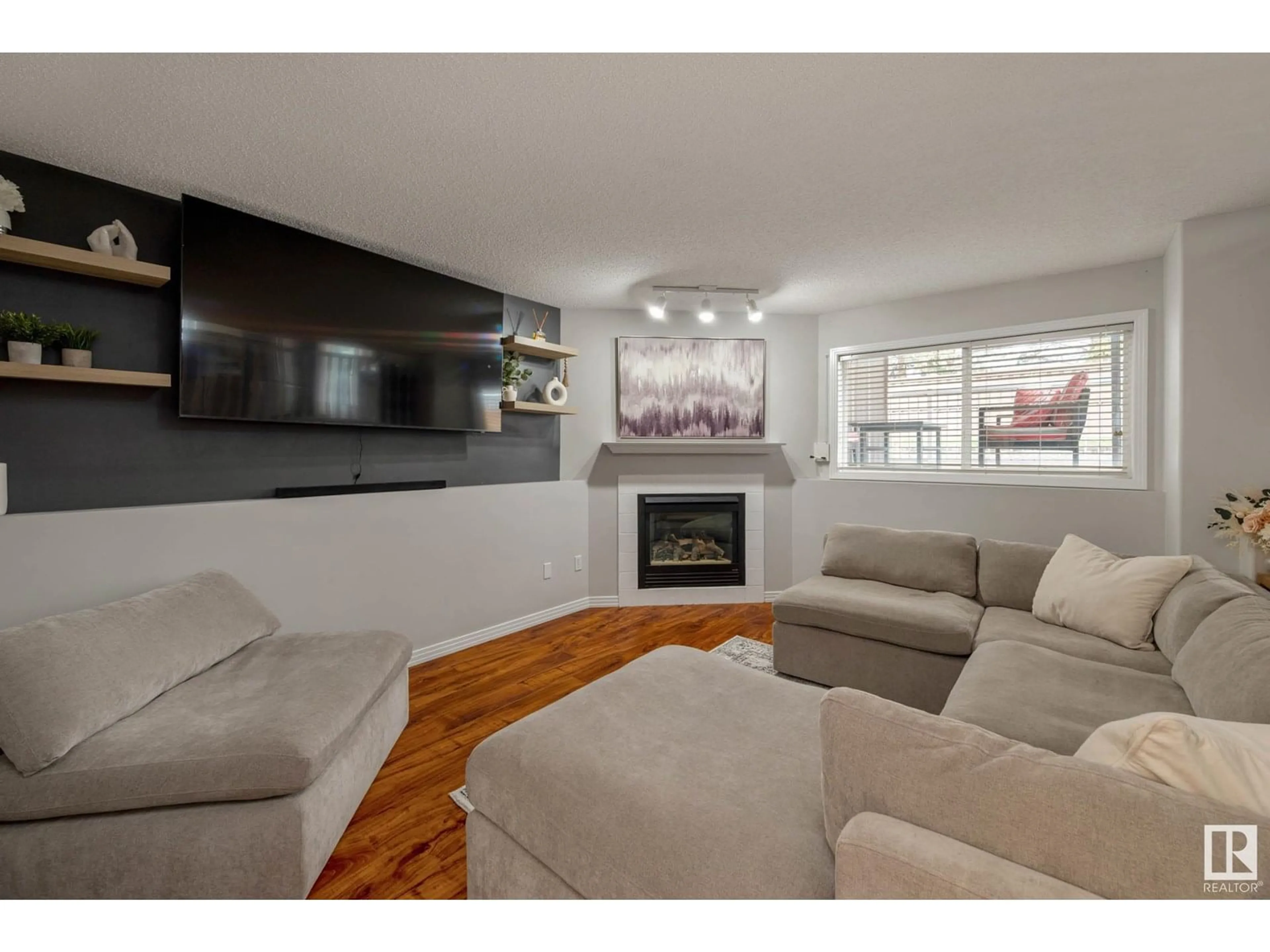 Living room with furniture, wood/laminate floor for NW - 16028 95 ST, Edmonton Alberta T5Z3N2