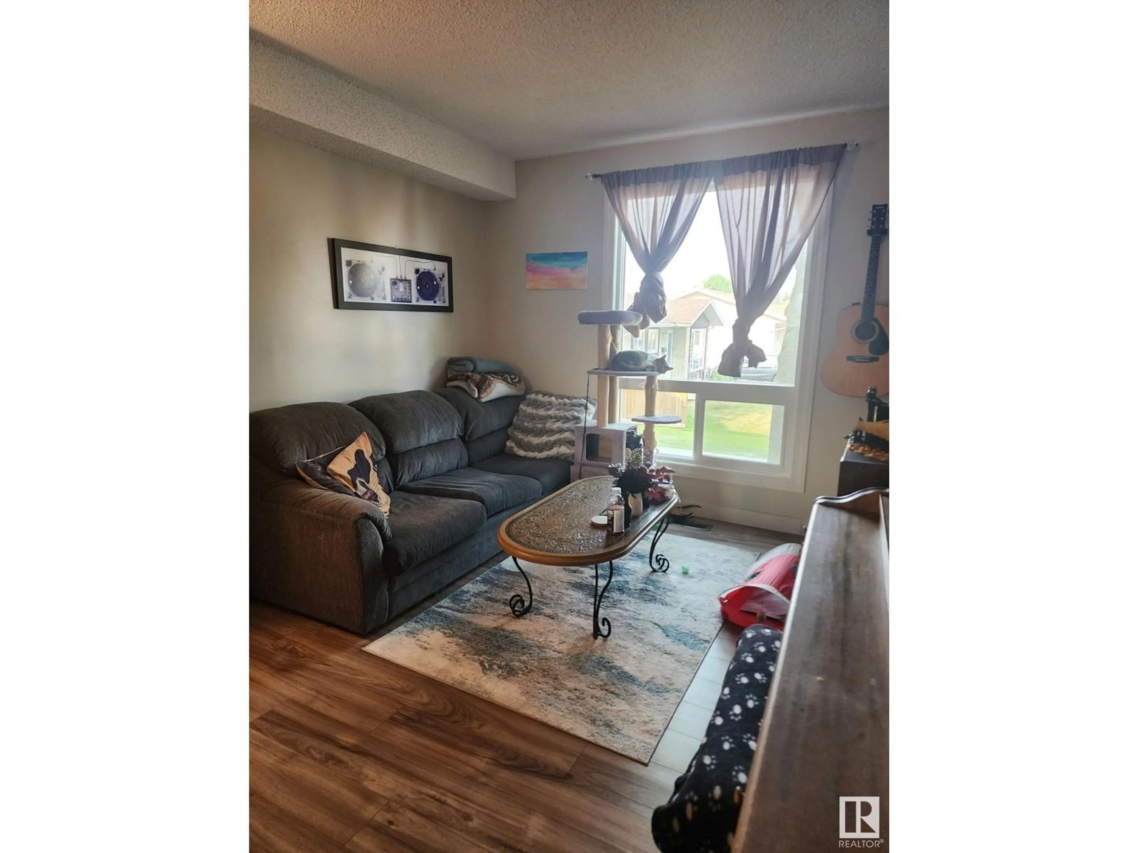 Living room with furniture, wood/laminate floor for NW - 14230 31 ST, Edmonton Alberta T5Y1H1