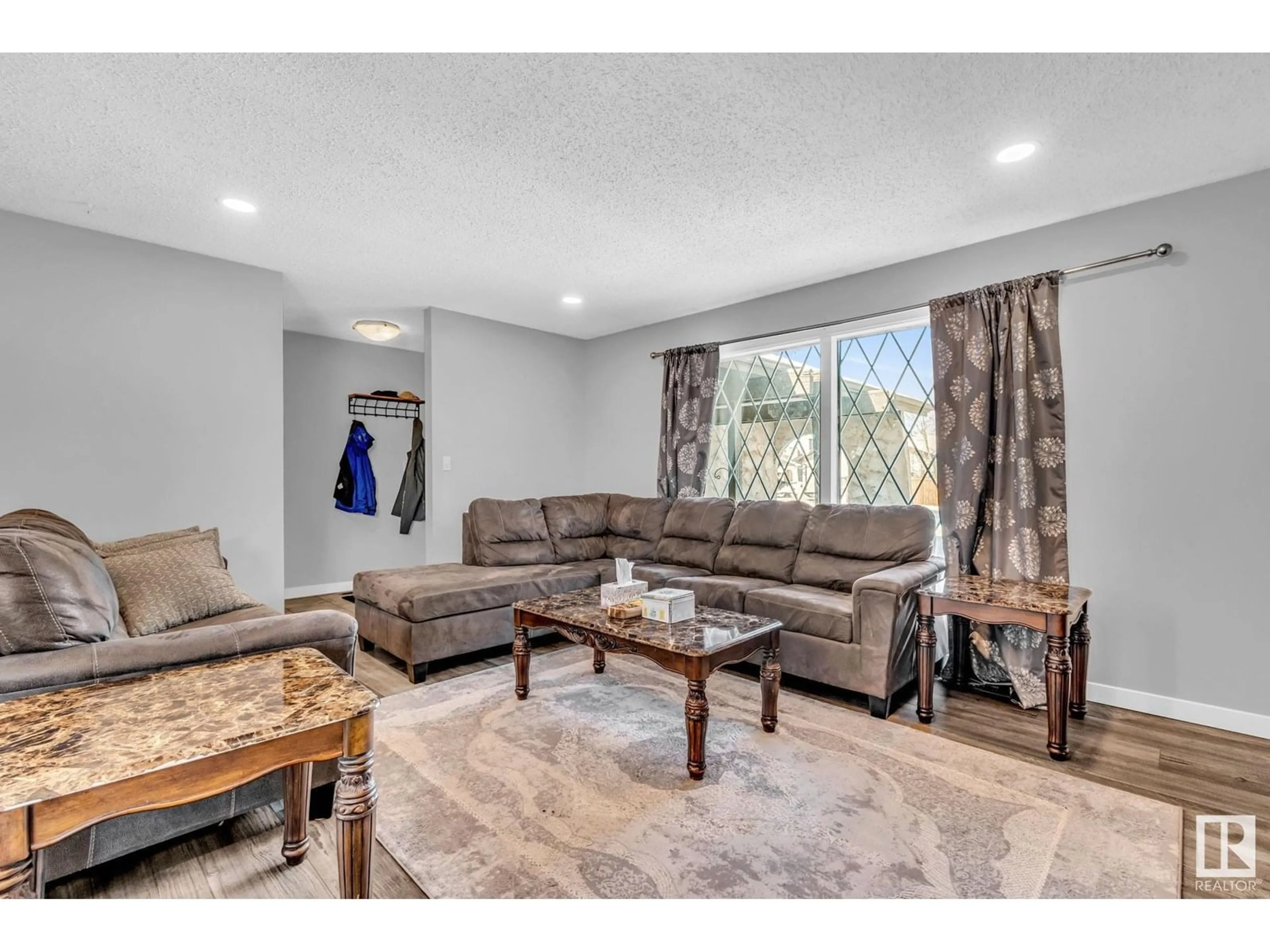 Living room with furniture, unknown for NW - 12135 152A AV, Edmonton Alberta T5X1R1