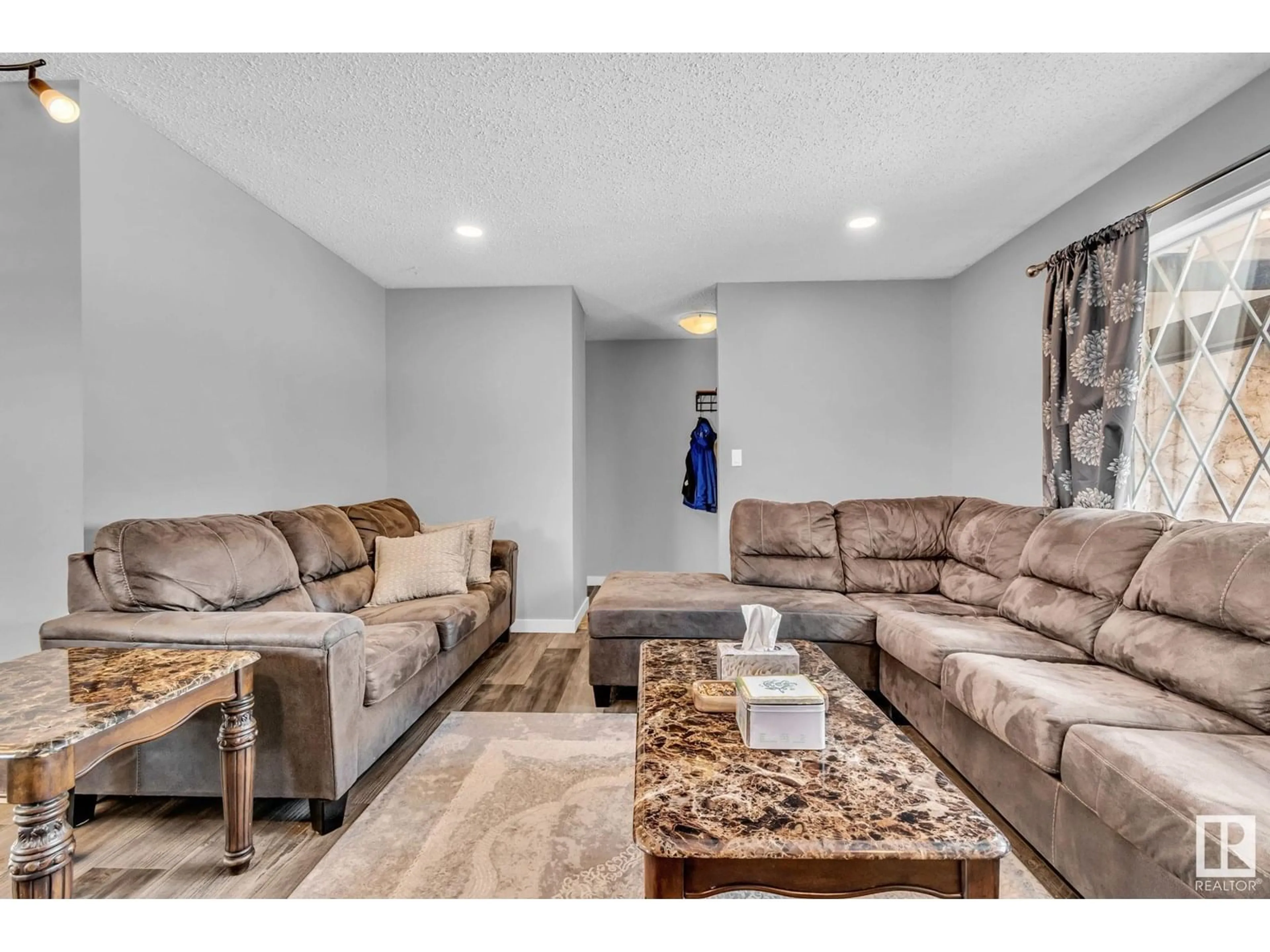 Living room with furniture, unknown for NW - 12135 152A AV, Edmonton Alberta T5X1R1