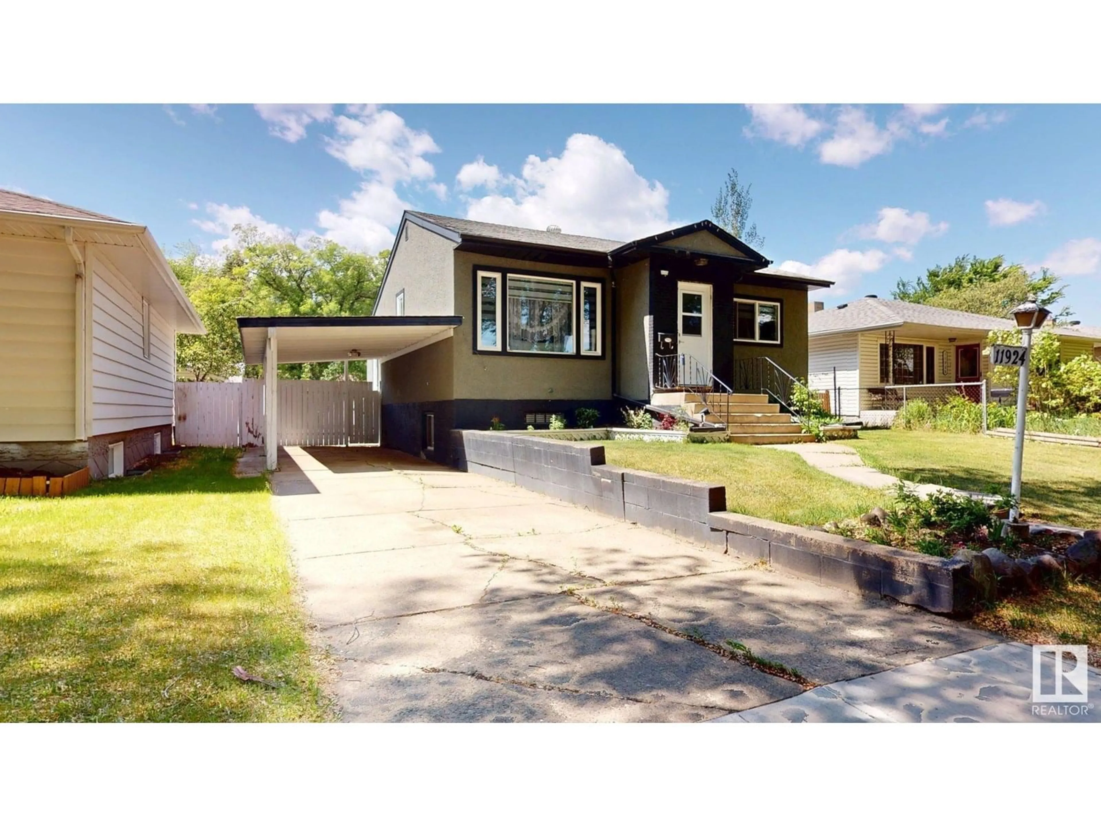 Home with vinyl exterior material, street for 11924 51 ST, Edmonton Alberta T5W3G4