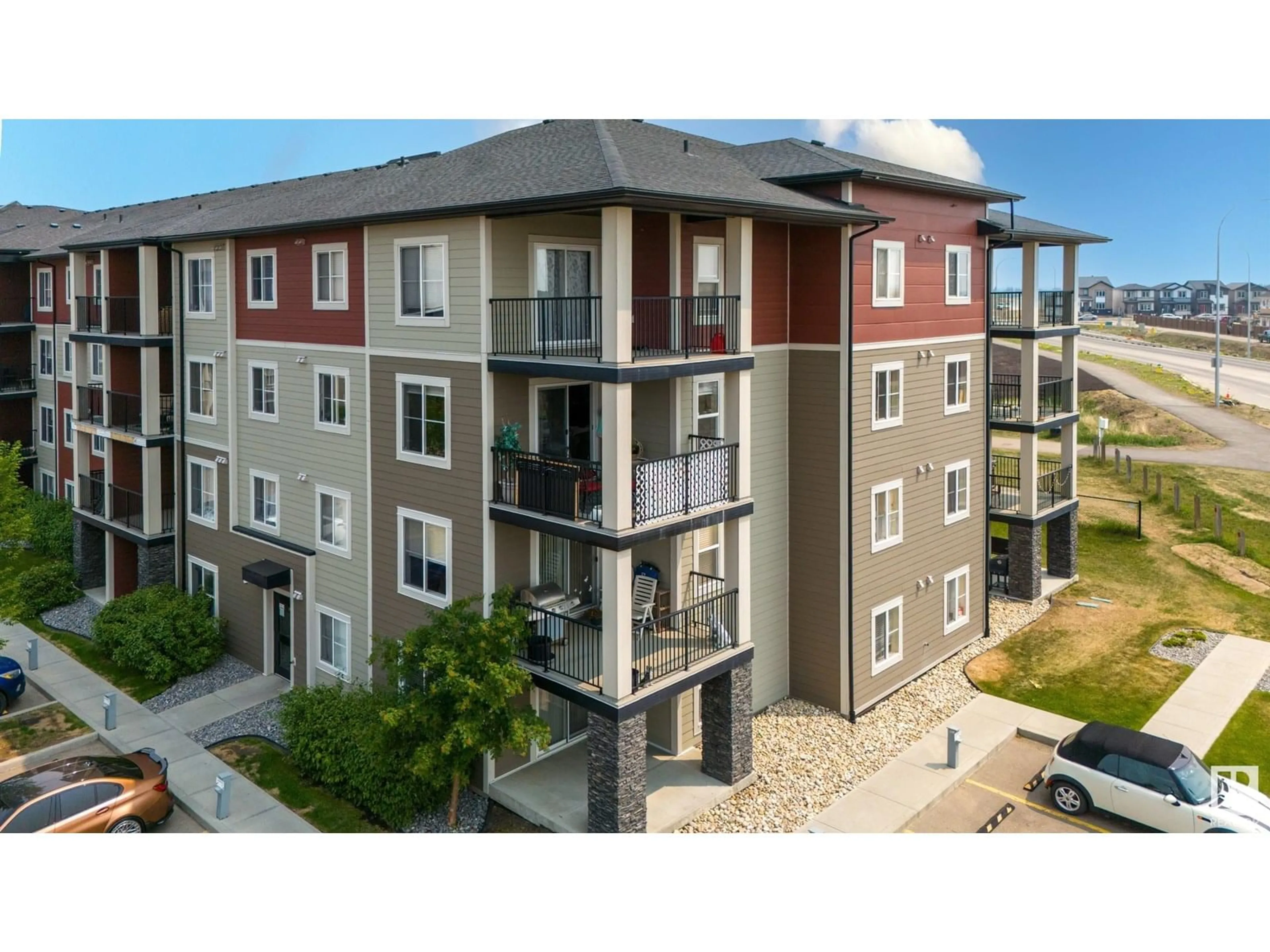 A pic from outside/outdoor area/front of a property/back of a property/a pic from drone, building for #302 - 1510 WATT DR, Edmonton Alberta T6X2E6