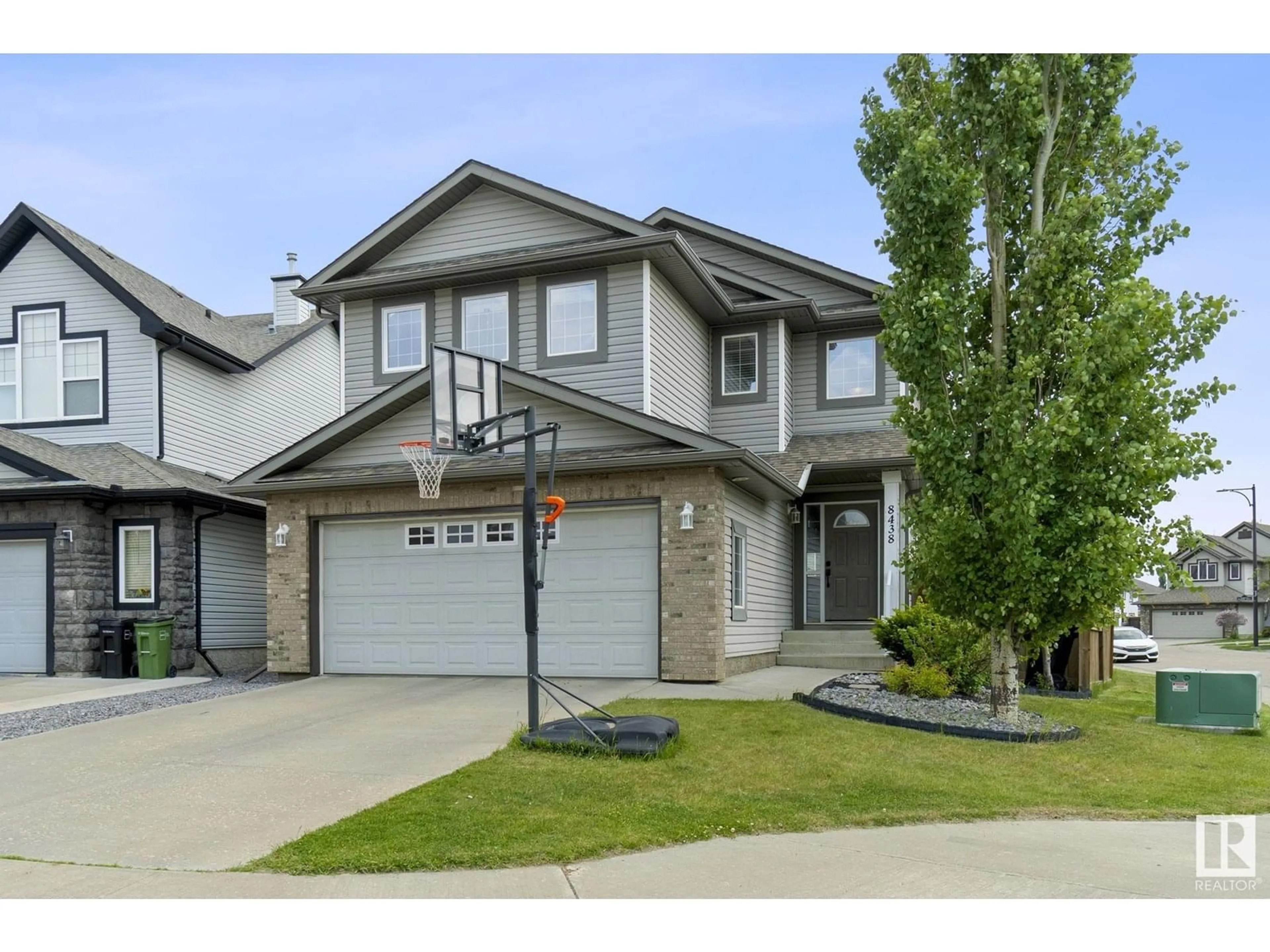 Home with vinyl exterior material, street for 8438 SLOANE CR, Edmonton Alberta T6R0L3