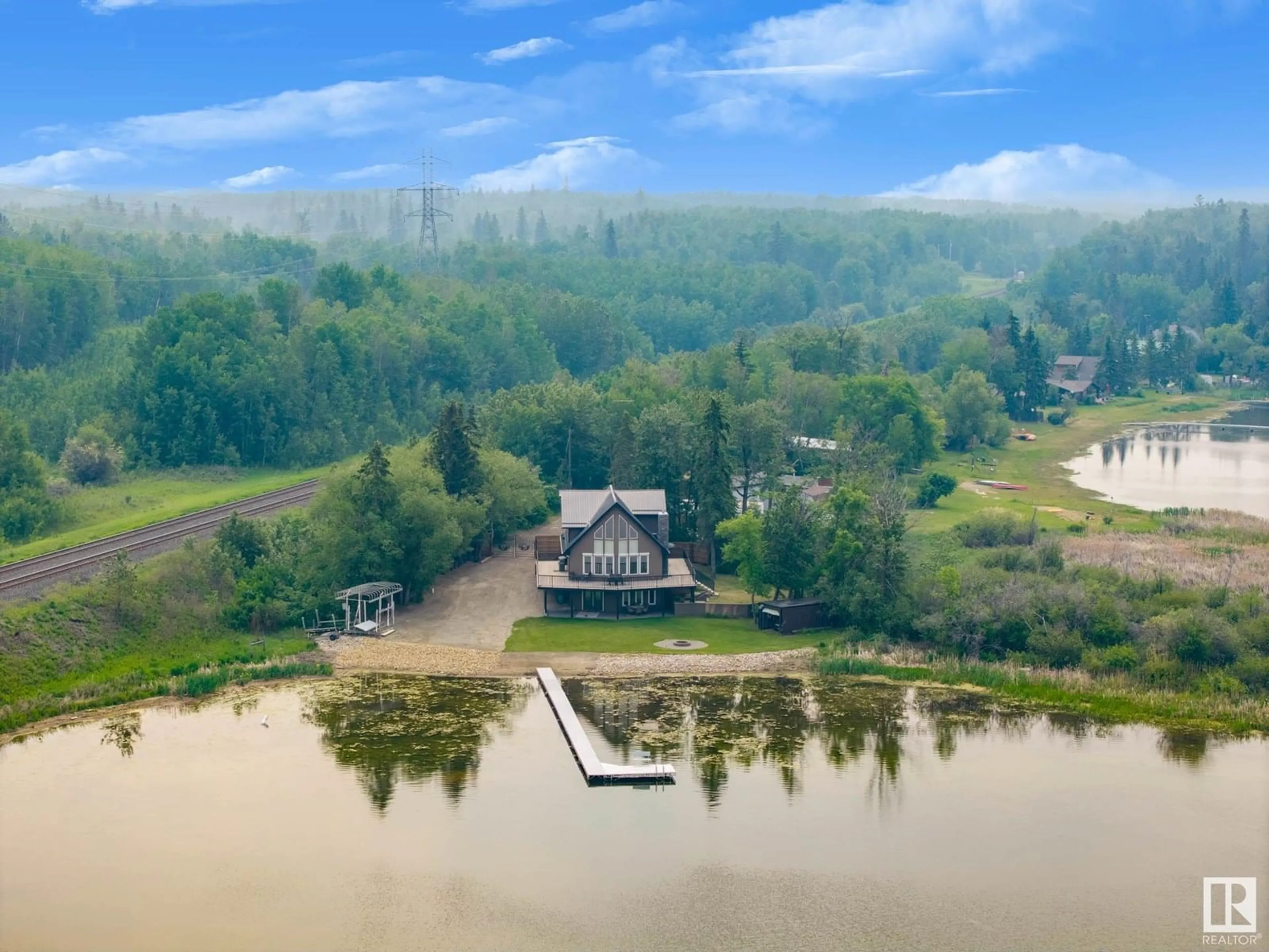 A pic from outside/outdoor area/front of a property/back of a property/a pic from drone, water/lake/river/ocean view for 47 RAILWAY AV, Rural Parkland County Alberta T0E2Y0