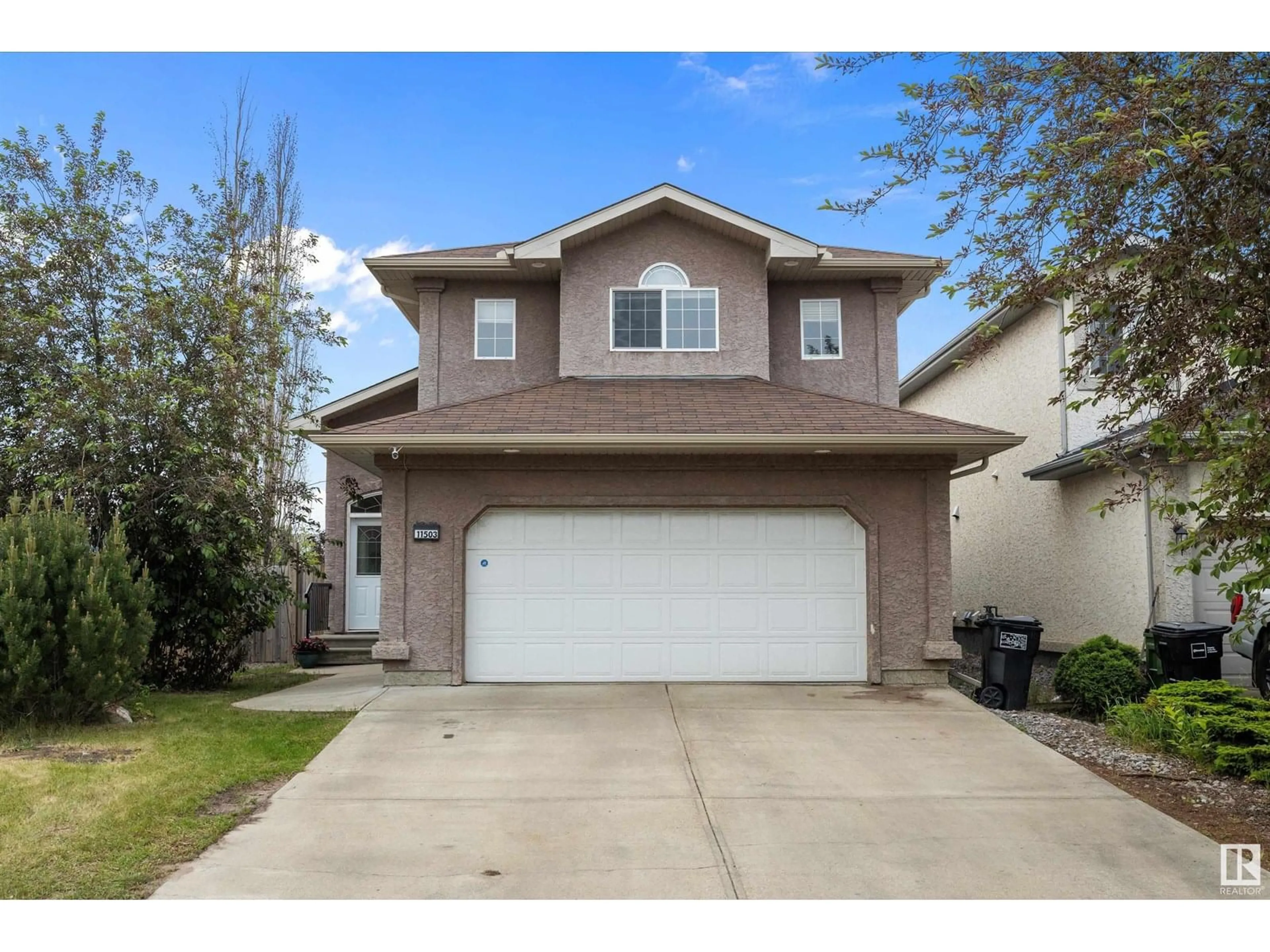 Home with vinyl exterior material, street for 11503 168 AV, Edmonton Alberta T5A6B6