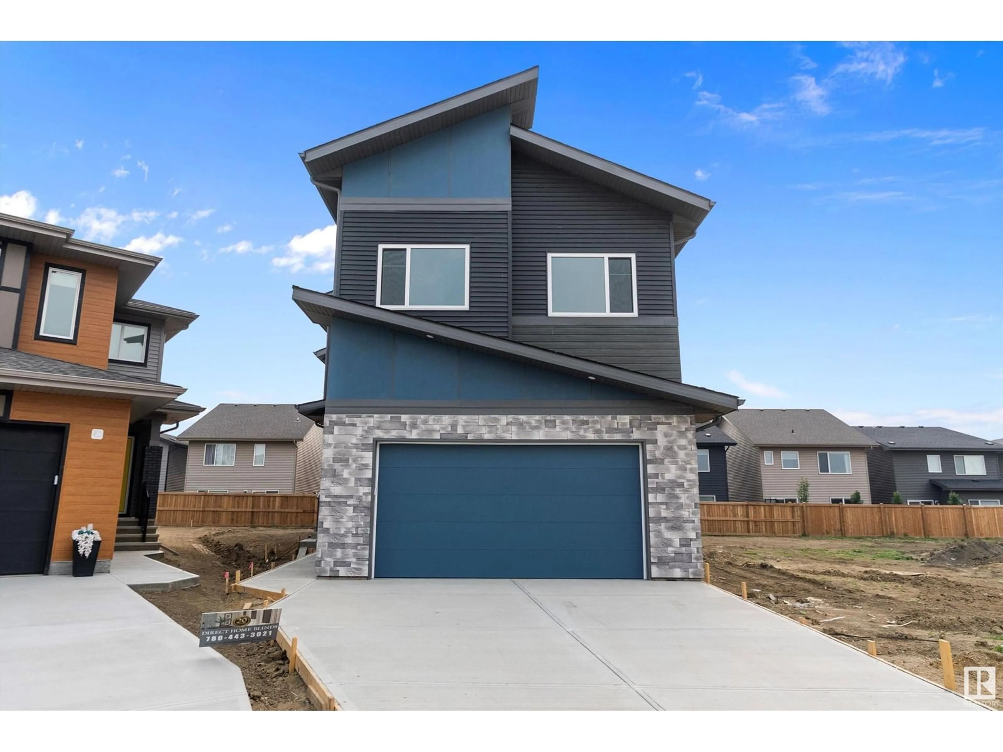 Home with brick exterior material, street for 2547 209 ST NW, Edmonton Alberta T6M2K7
