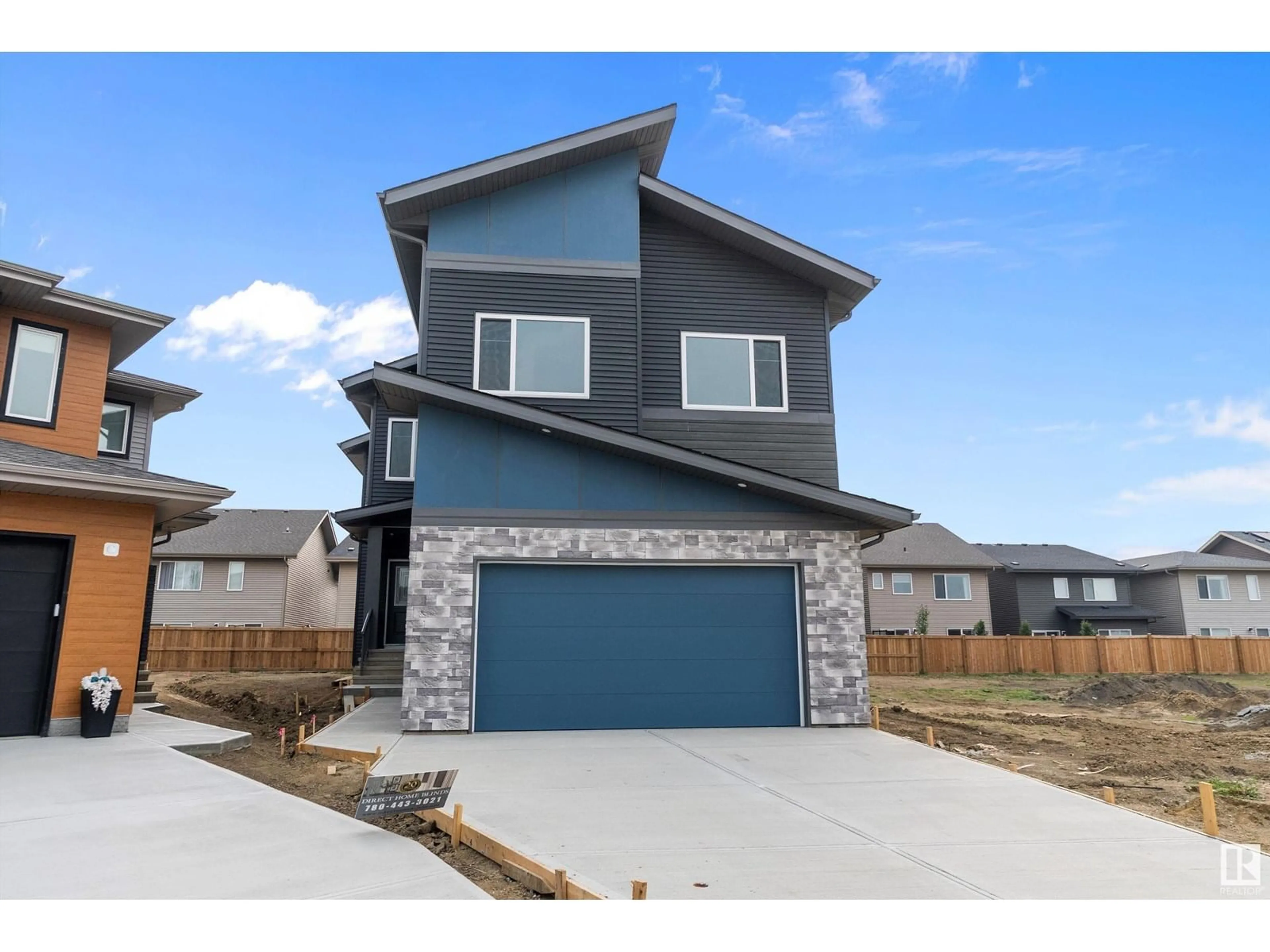 Home with brick exterior material, street for 2547 209 ST NW, Edmonton Alberta T6M2K7