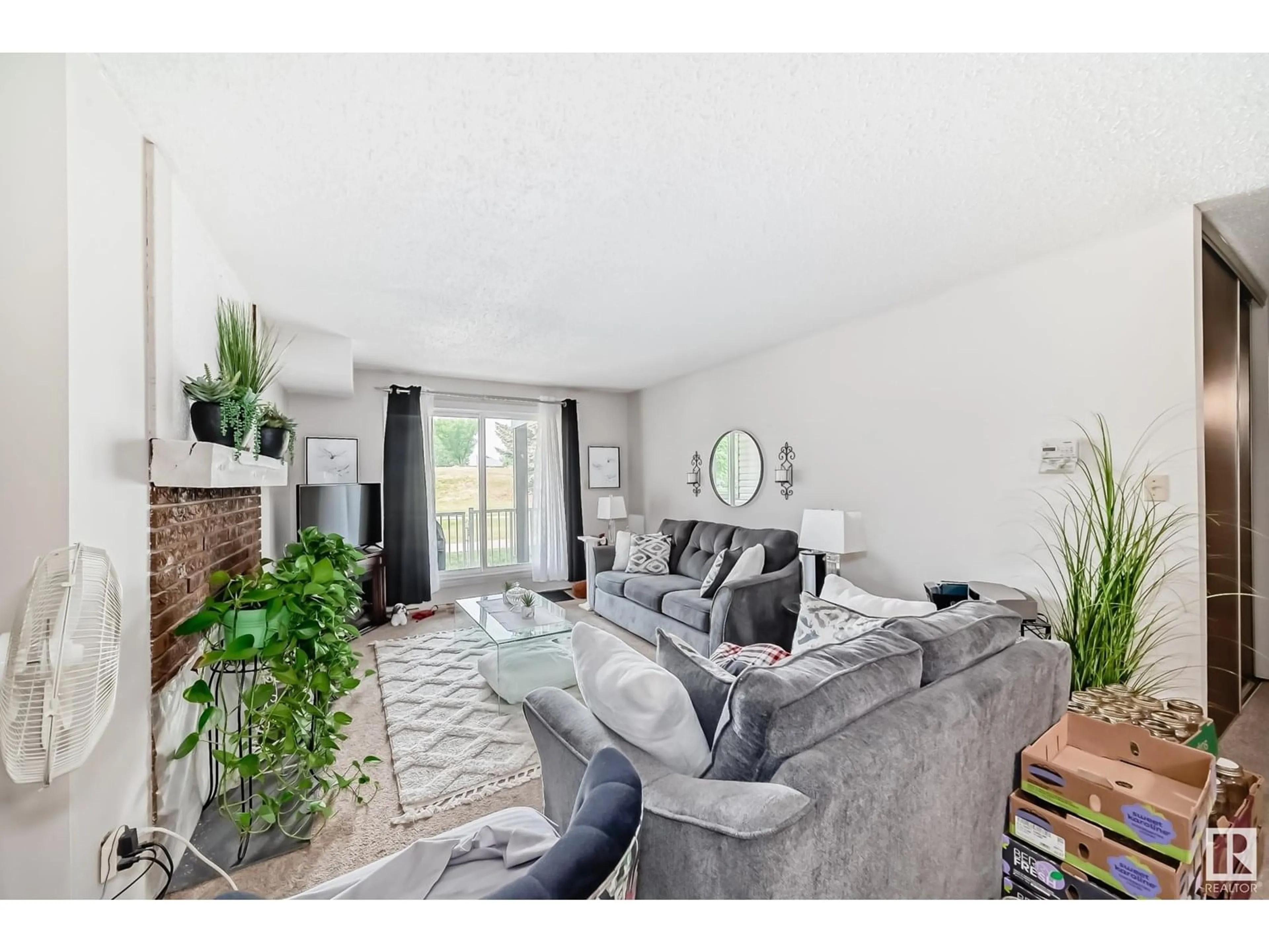 Living room with furniture, unknown for #105 - 6212 180 ST NW, Edmonton Alberta T5T2T2