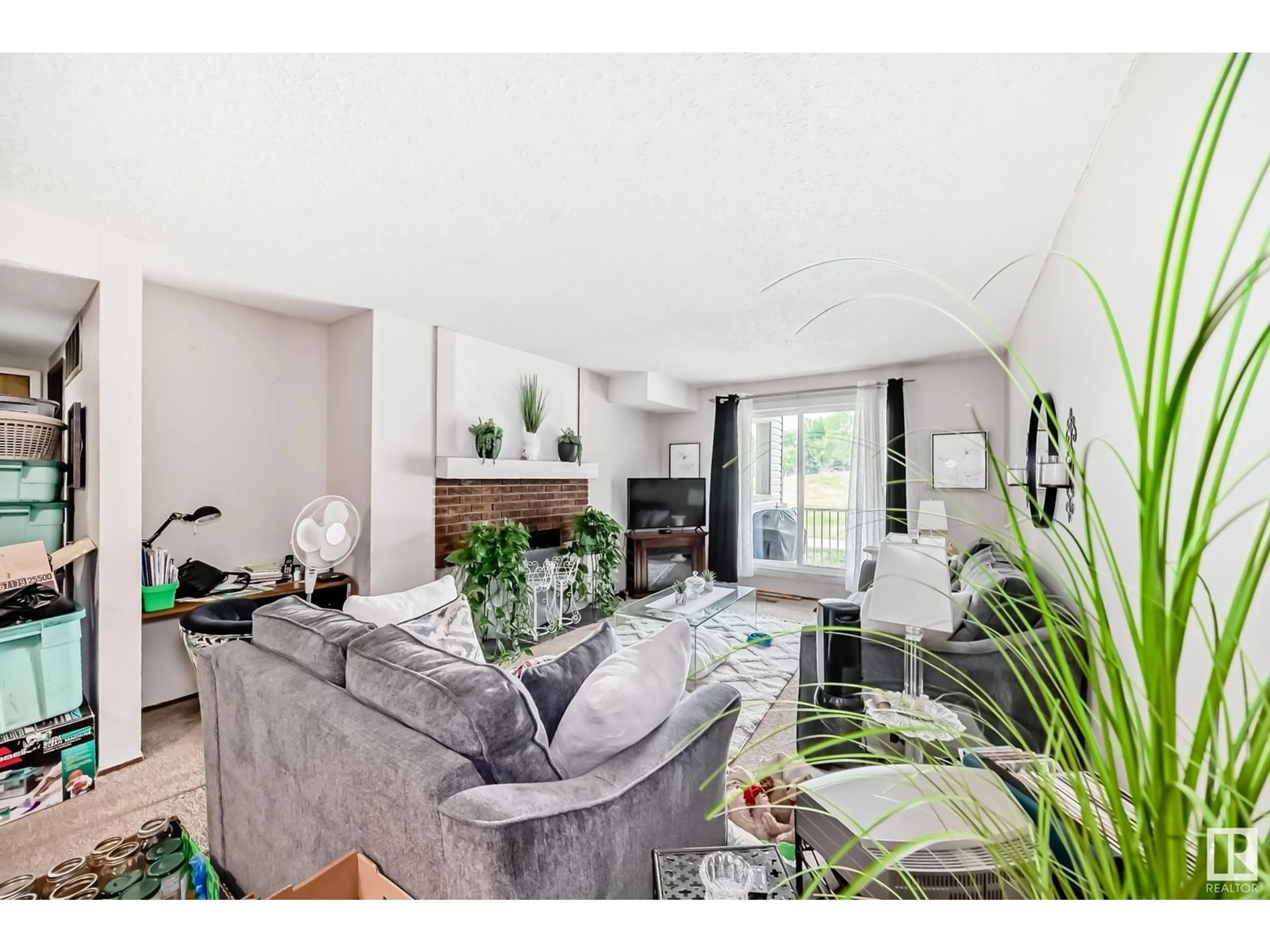 Living room with furniture, unknown for #105 - 6212 180 ST NW, Edmonton Alberta T5T2T2