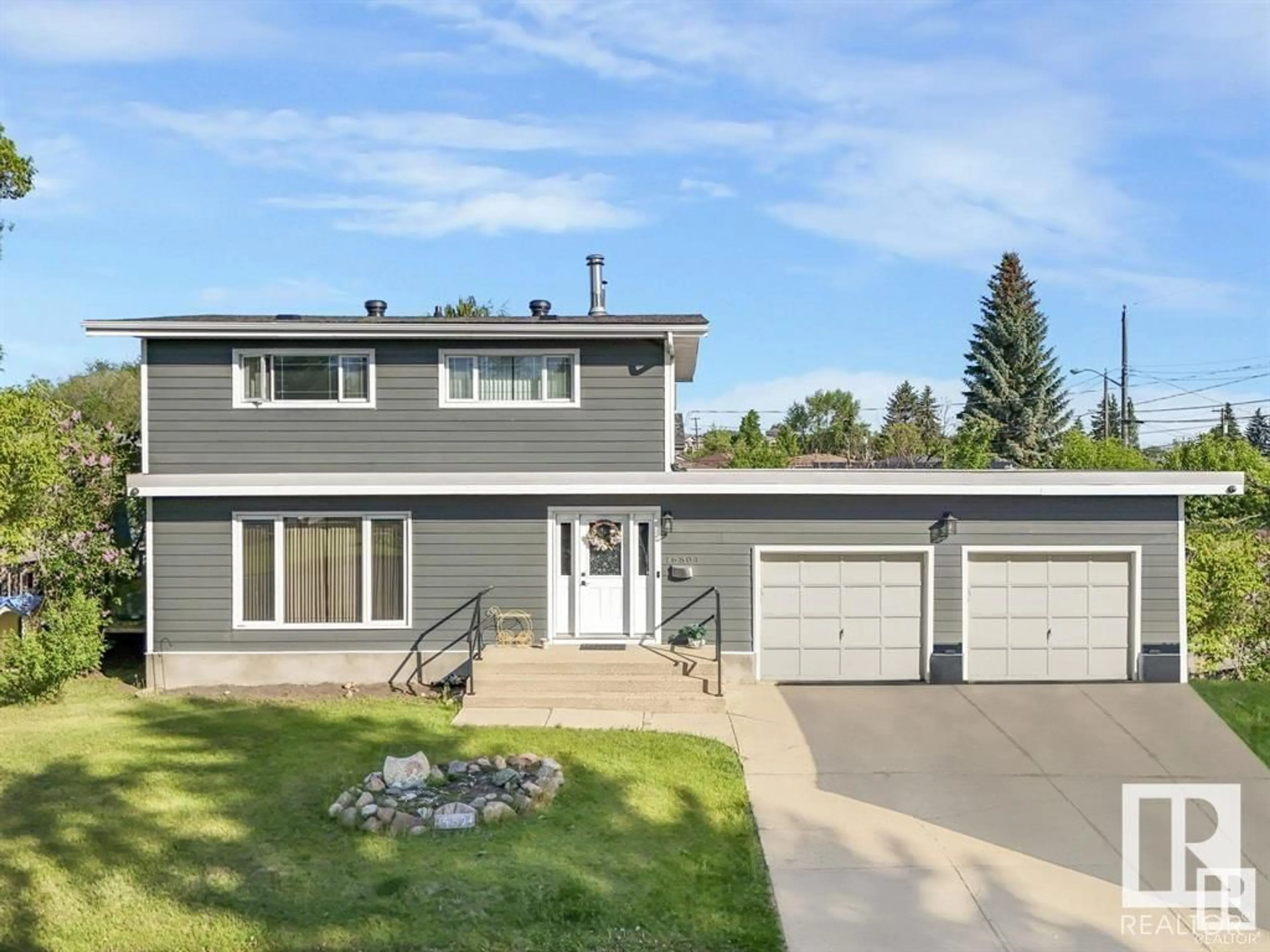 Home with vinyl exterior material, street for 16804 93A AV, Edmonton Alberta T5R5K3