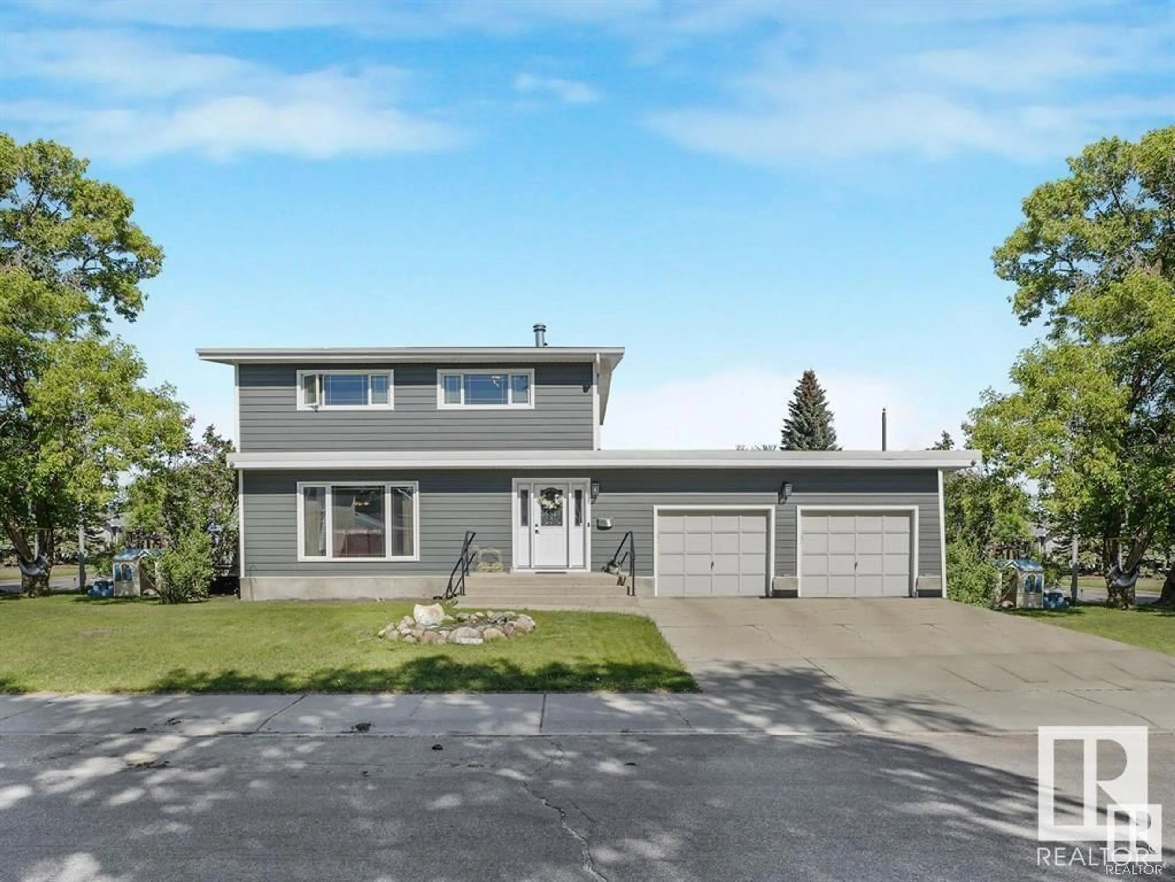 Home with vinyl exterior material, street for 16804 93A AV, Edmonton Alberta T5R5K3