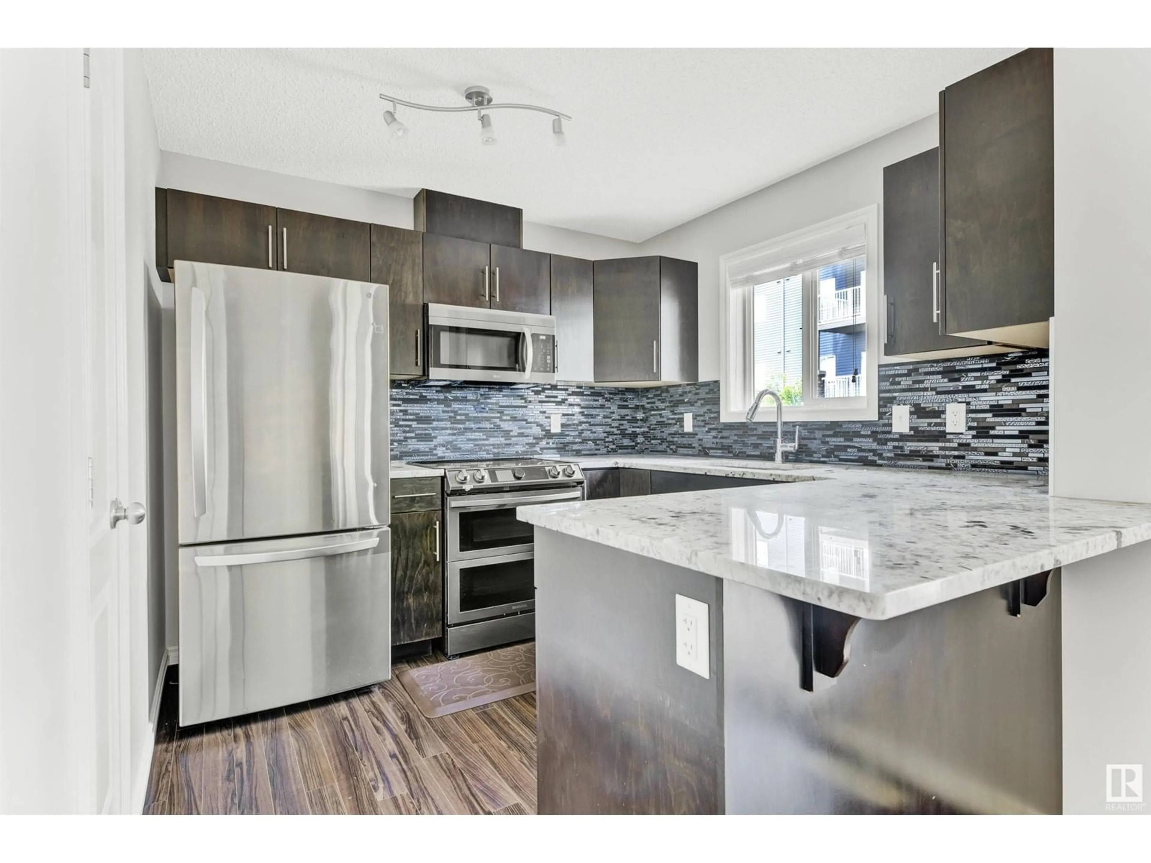 Open concept kitchen, unknown for 30 12004 22 AV SW, Edmonton Alberta T6W0T1