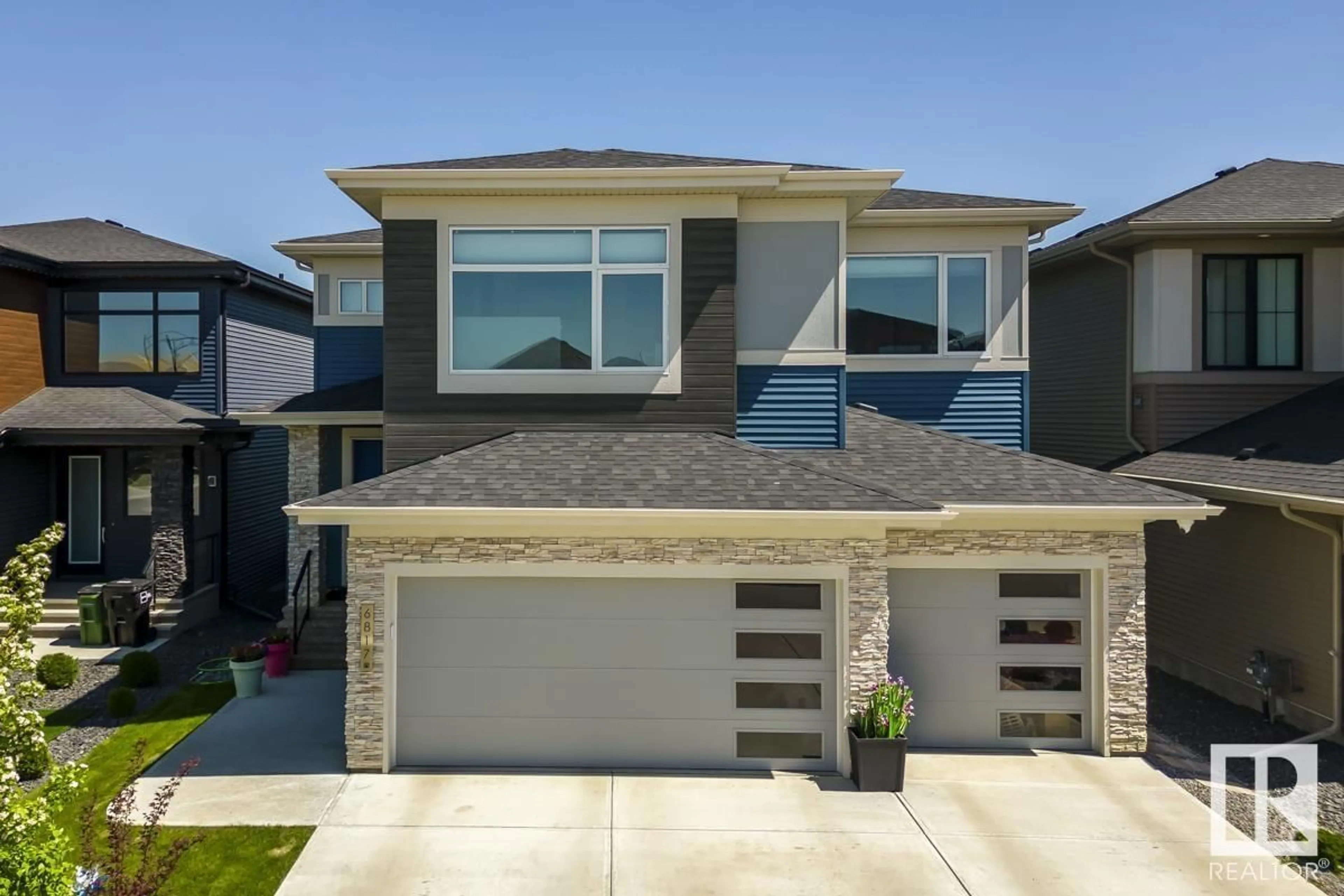 Home with vinyl exterior material, street for SW - 6817 KNOX LO, Edmonton Alberta T6W4R3