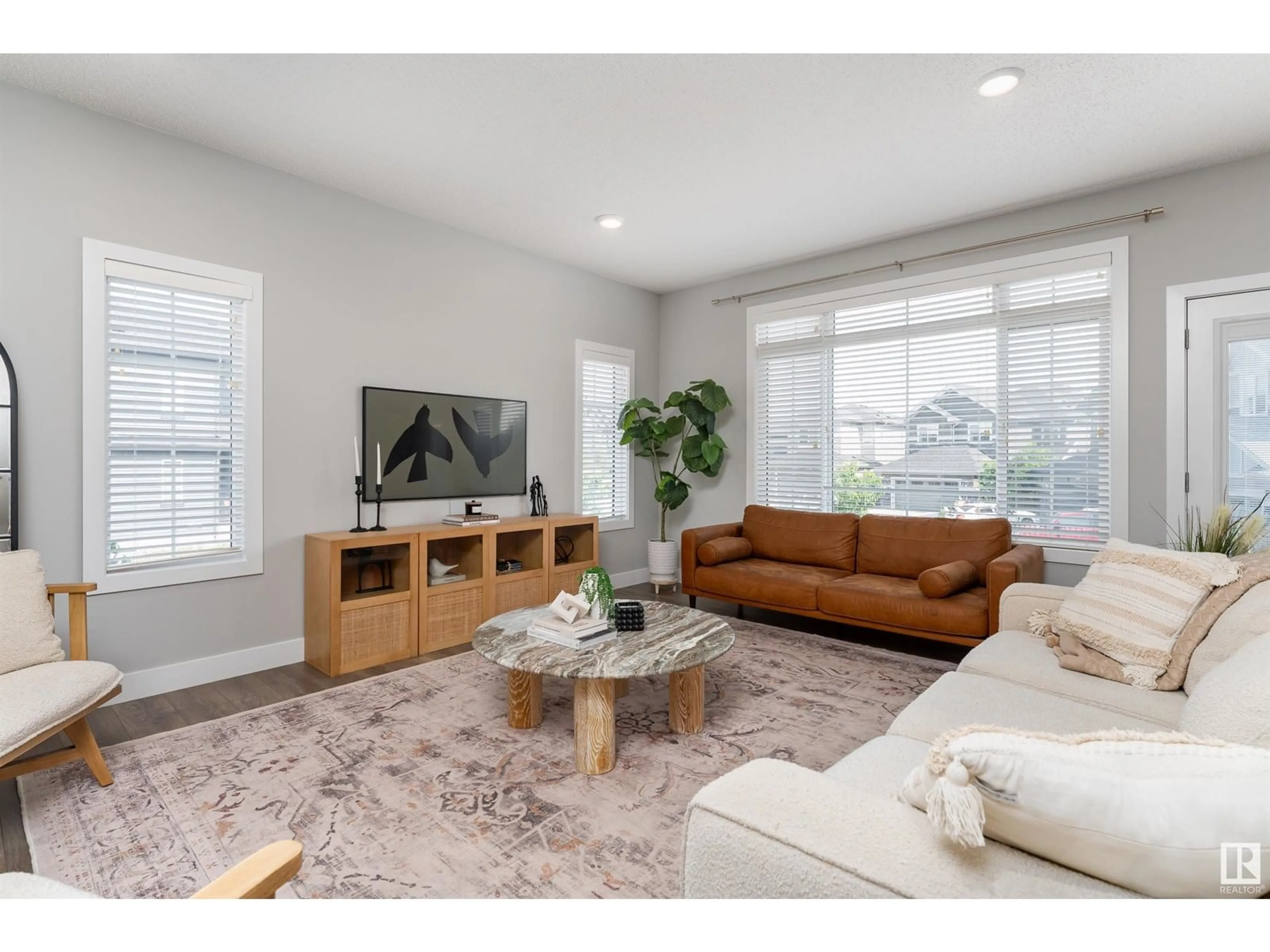 Living room with furniture, wood/laminate floor for 5804 KEEPING CO, Edmonton Alberta T6W4K4