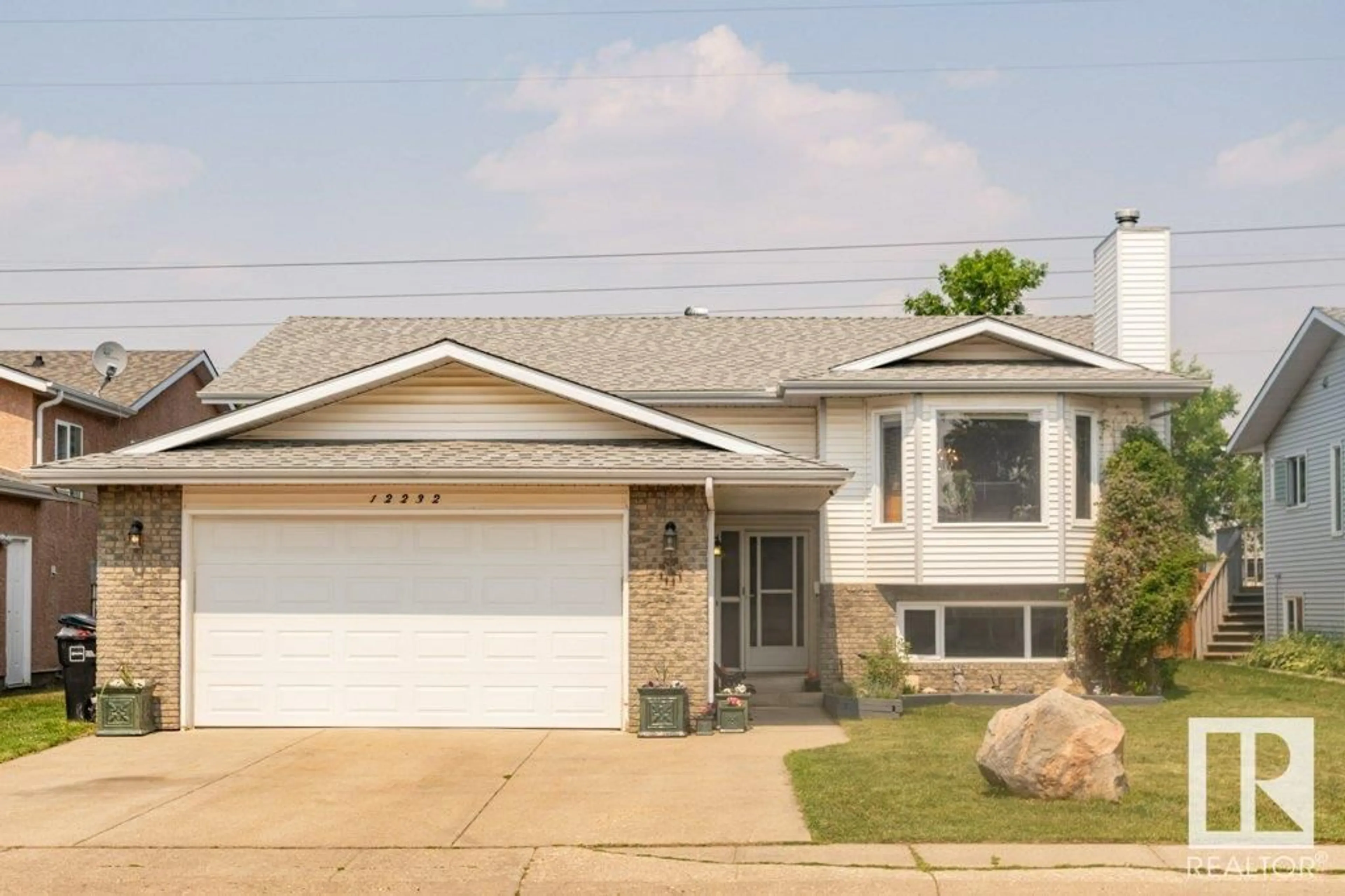 Home with vinyl exterior material, street for 12232 151A AV, Edmonton Alberta T5X4A2