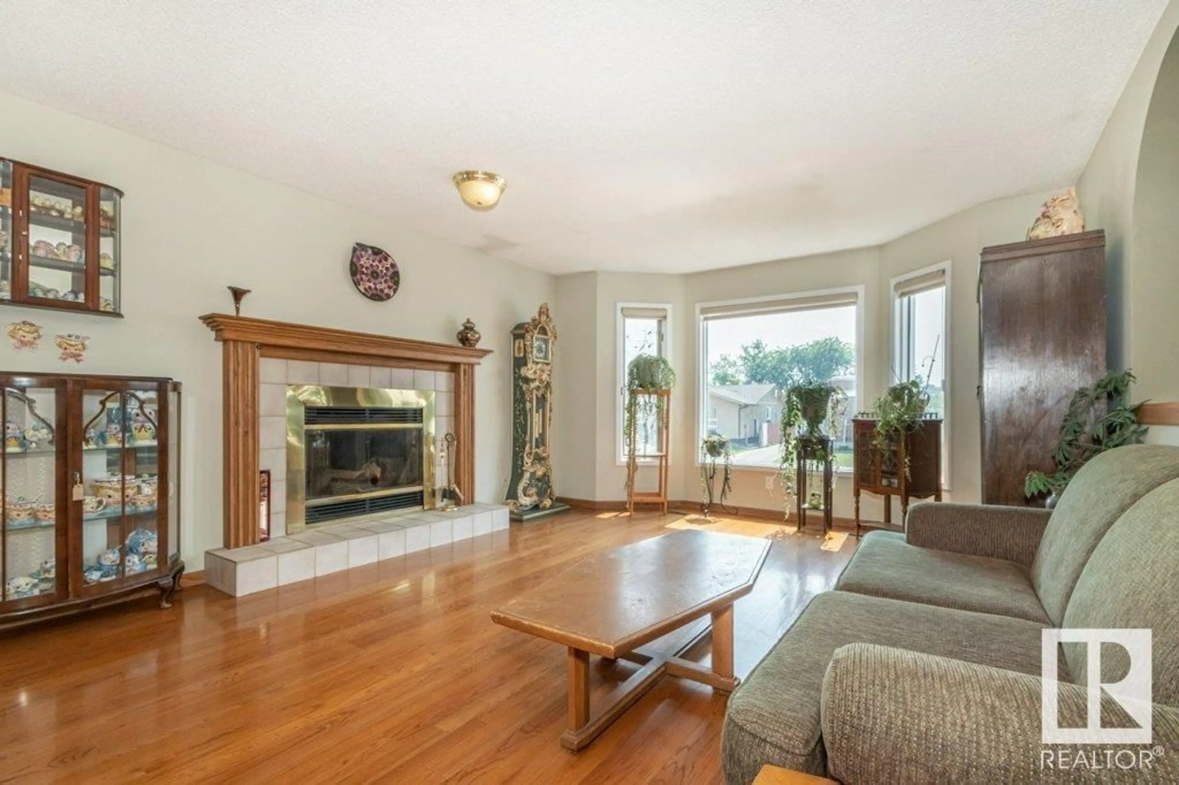 Living room with furniture, wood/laminate floor for 12232 151A AV, Edmonton Alberta T5X4A2