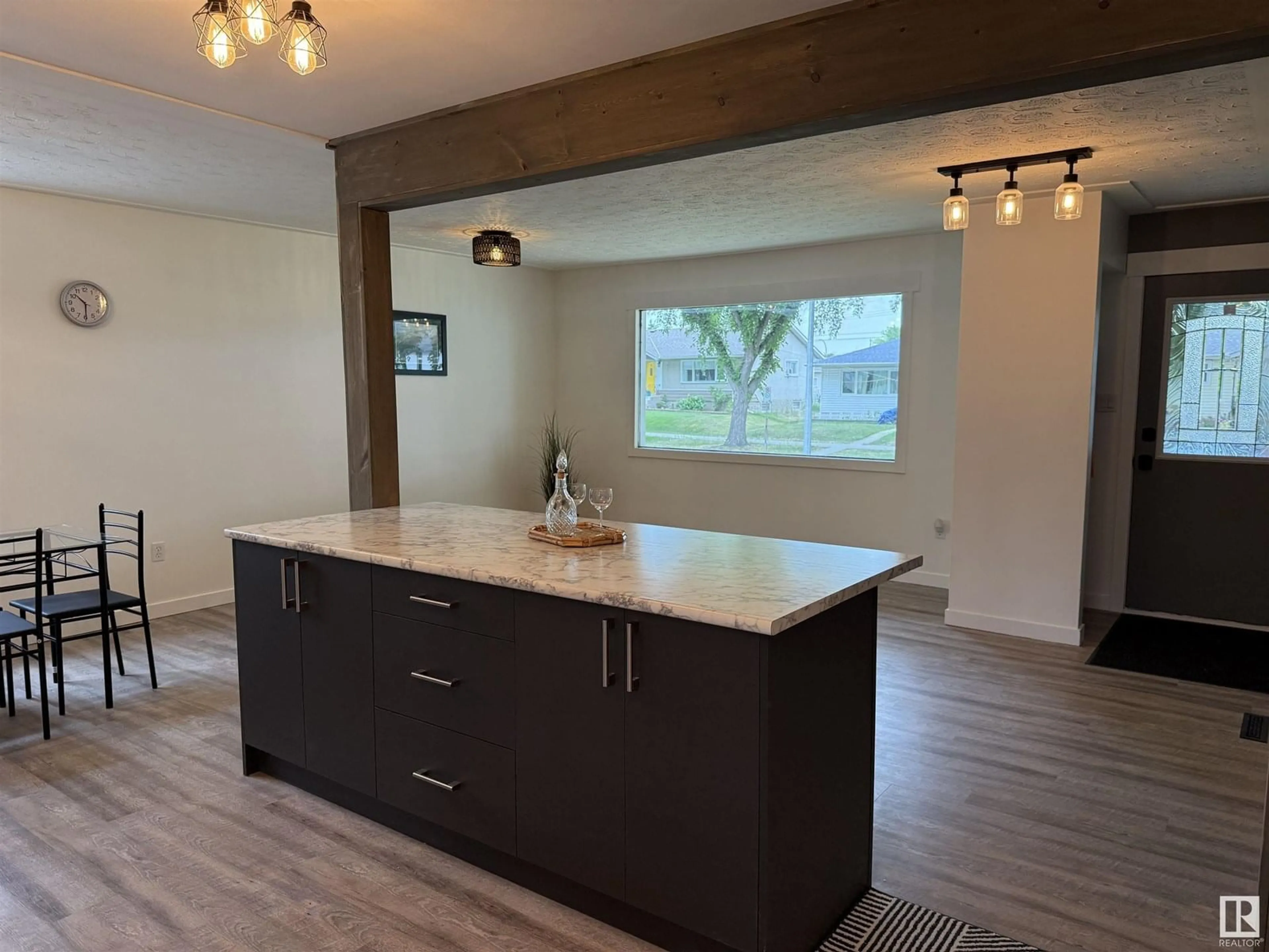 Open concept kitchen, wood/laminate floor for NW - 12220 55 ST, Edmonton Alberta T6B1W5