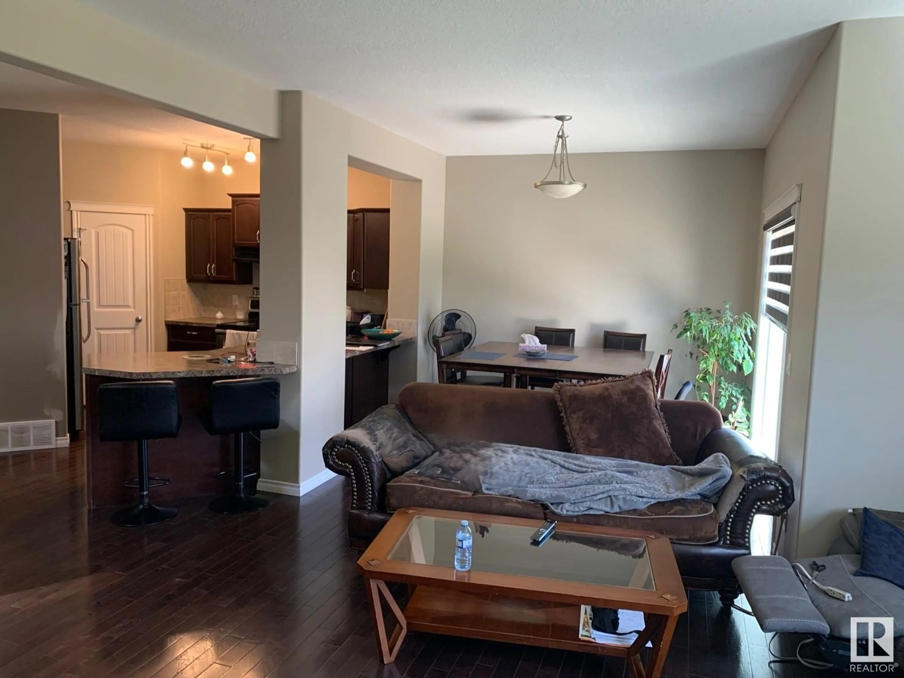 Living room with furniture, wood/laminate floor for SW - 1741 63A ST, Edmonton Alberta T6X0S1