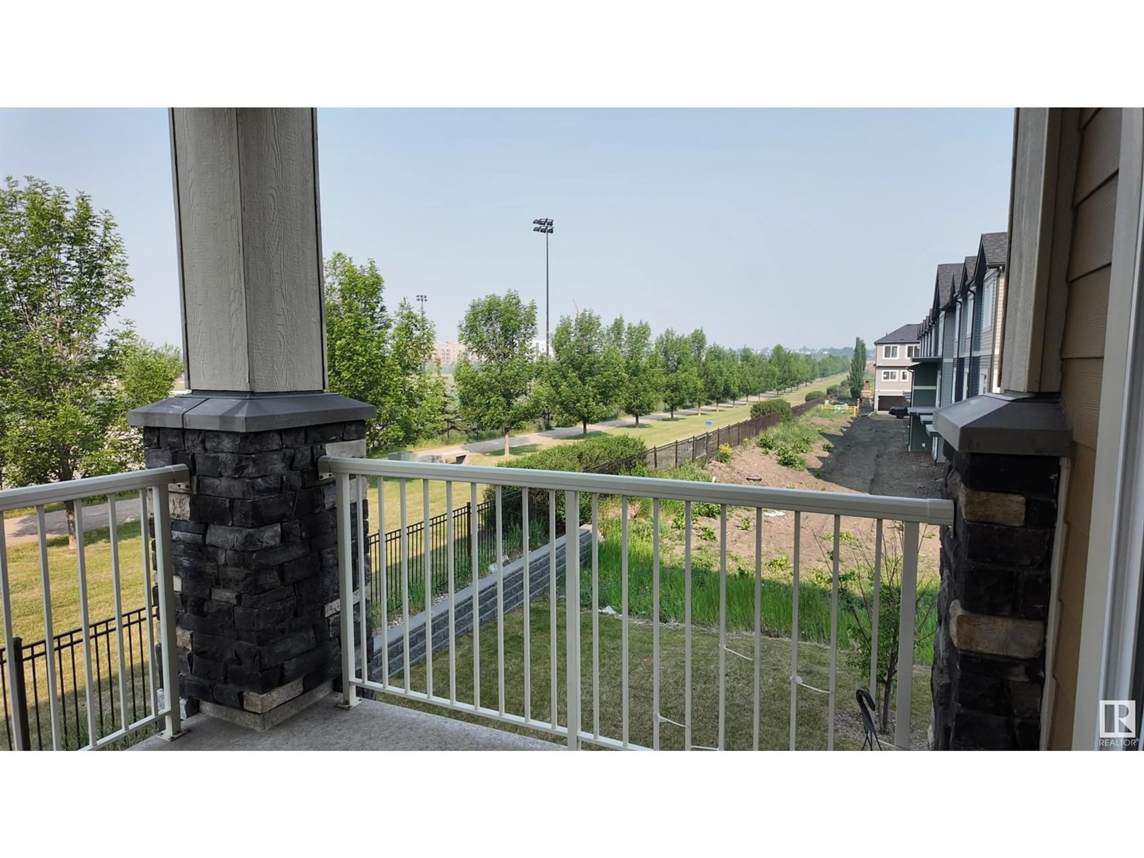 Balcony in the apartment, city buildings view from balcony for 206 - 3670 139 AV, Edmonton Alberta T5Y3N5
