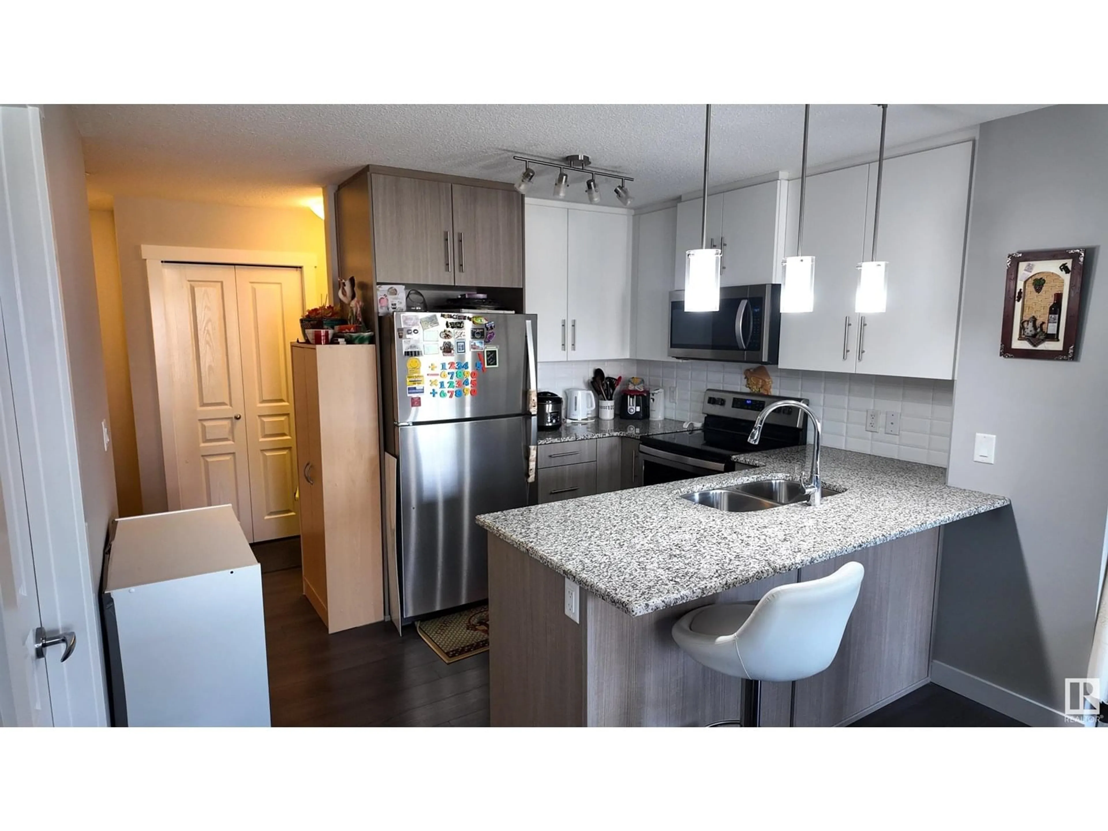 Open concept kitchen, unknown for 206 - 3670 139 AV, Edmonton Alberta T5Y3N5
