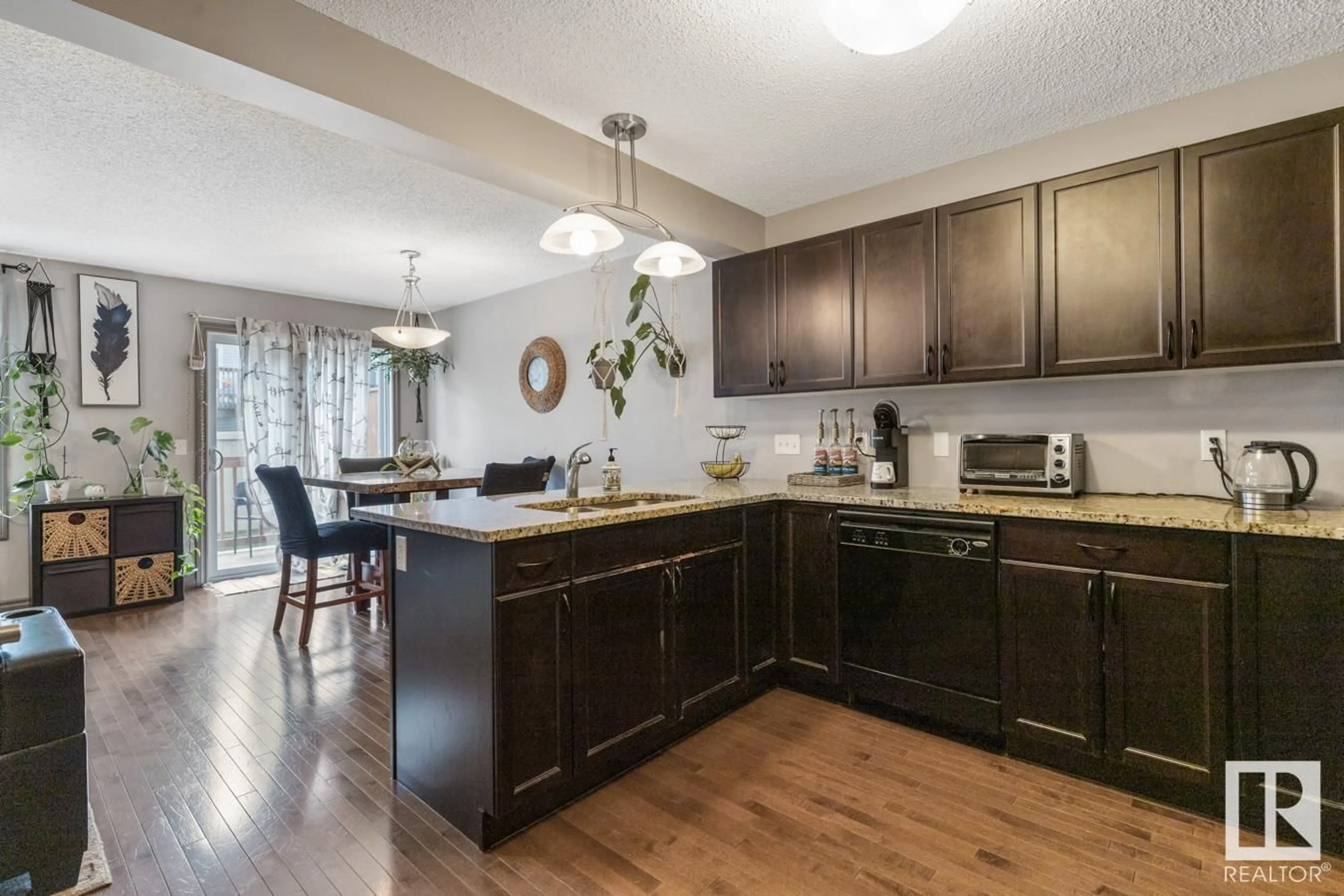 Open concept kitchen, wood/laminate floor for 23 - 2005 70 ST, Edmonton Alberta T6X0T9