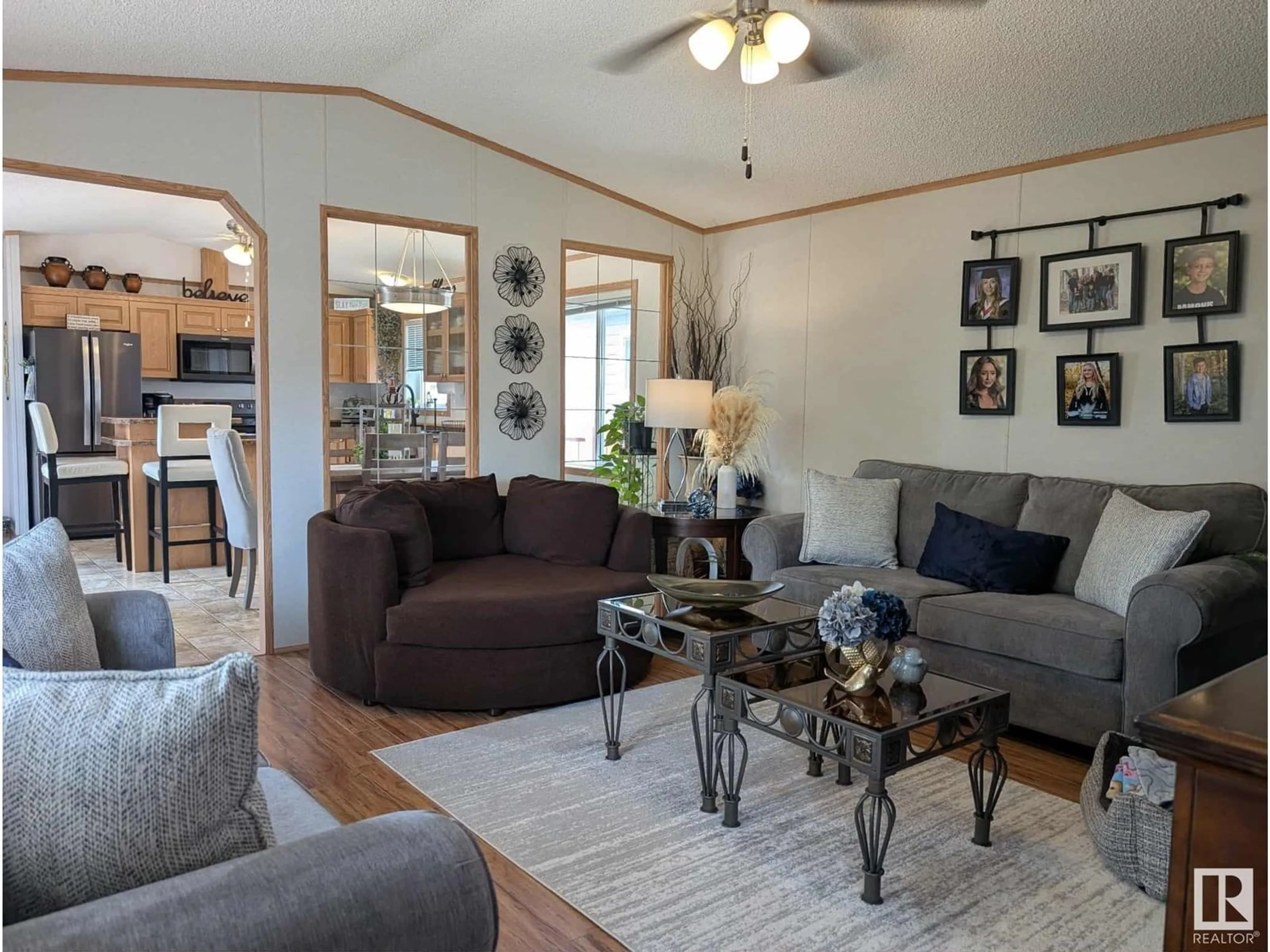 Living room with furniture, wood/laminate floor for 109 JUTLAND CR, Stony Plain Alberta T7Z0A3