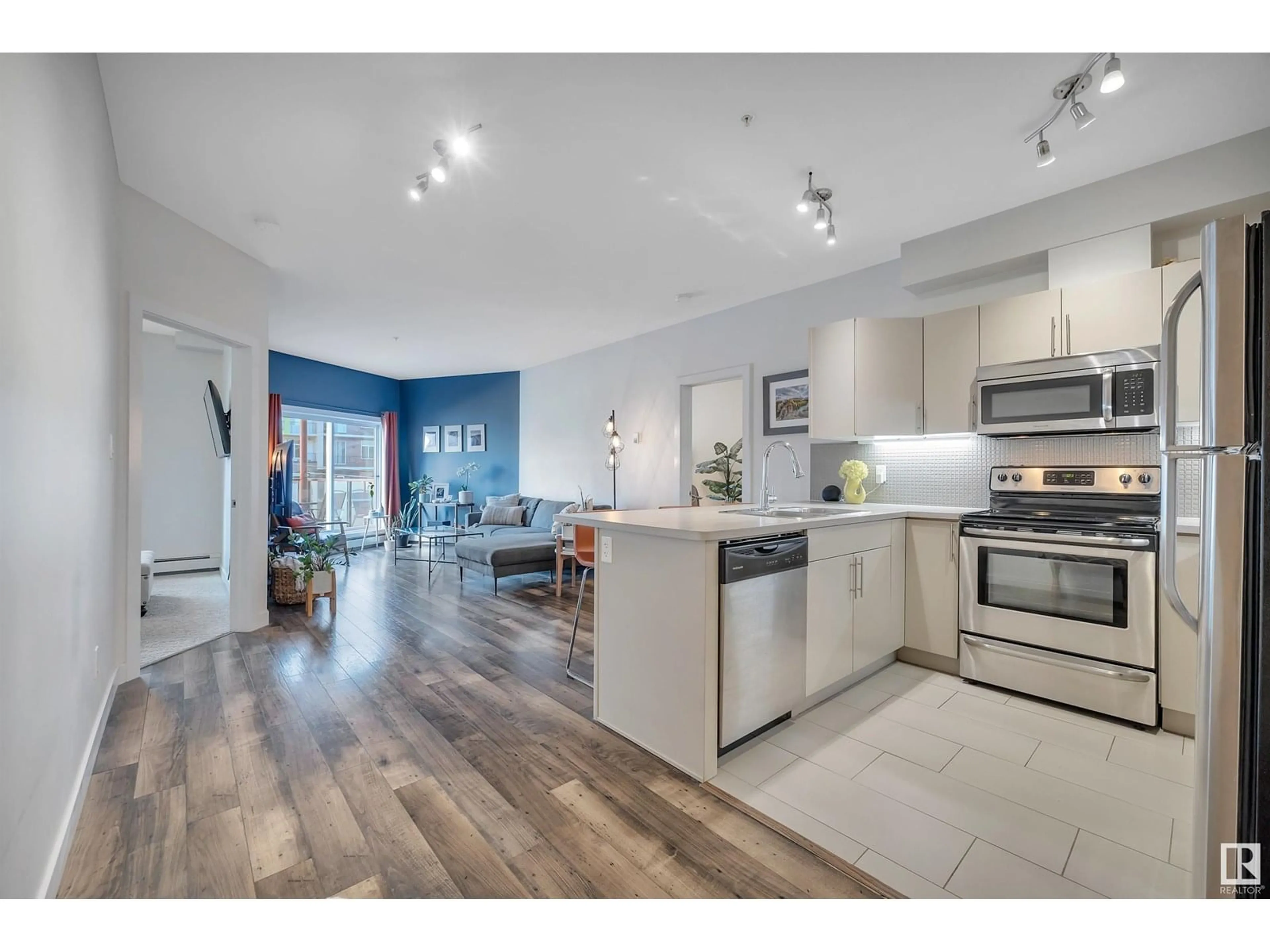 Open concept kitchen, wood/laminate floor for #208 - 10611 117 ST, Edmonton Alberta T5H0G6