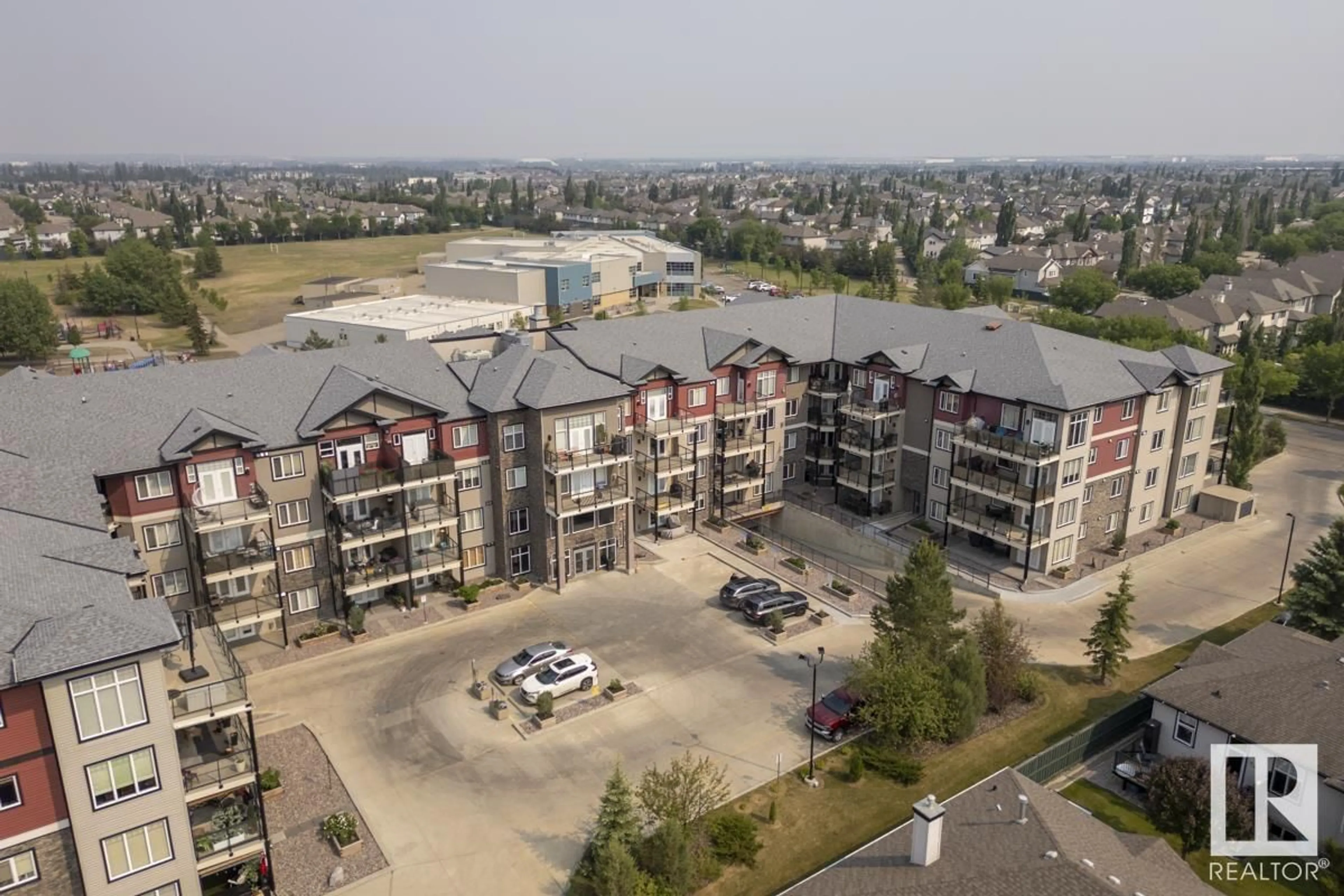 A pic from outside/outdoor area/front of a property/back of a property/a pic from drone, unknown for 203 - 12408 15 AV, Edmonton Alberta T6W1X2