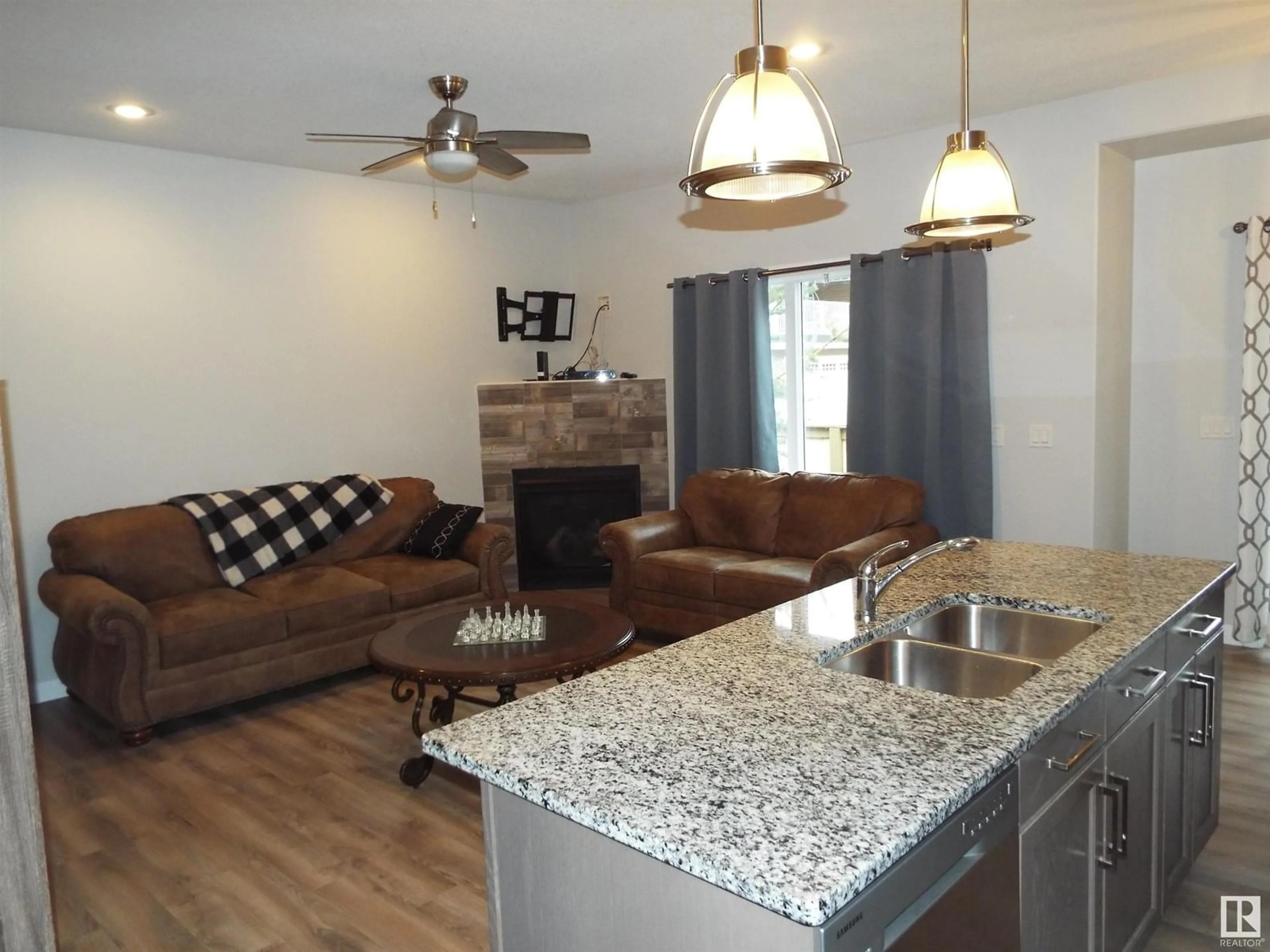 Open concept kitchen, wood/laminate floor for #108 - 300 AWENTIA DR, Leduc Alberta T9E2X2